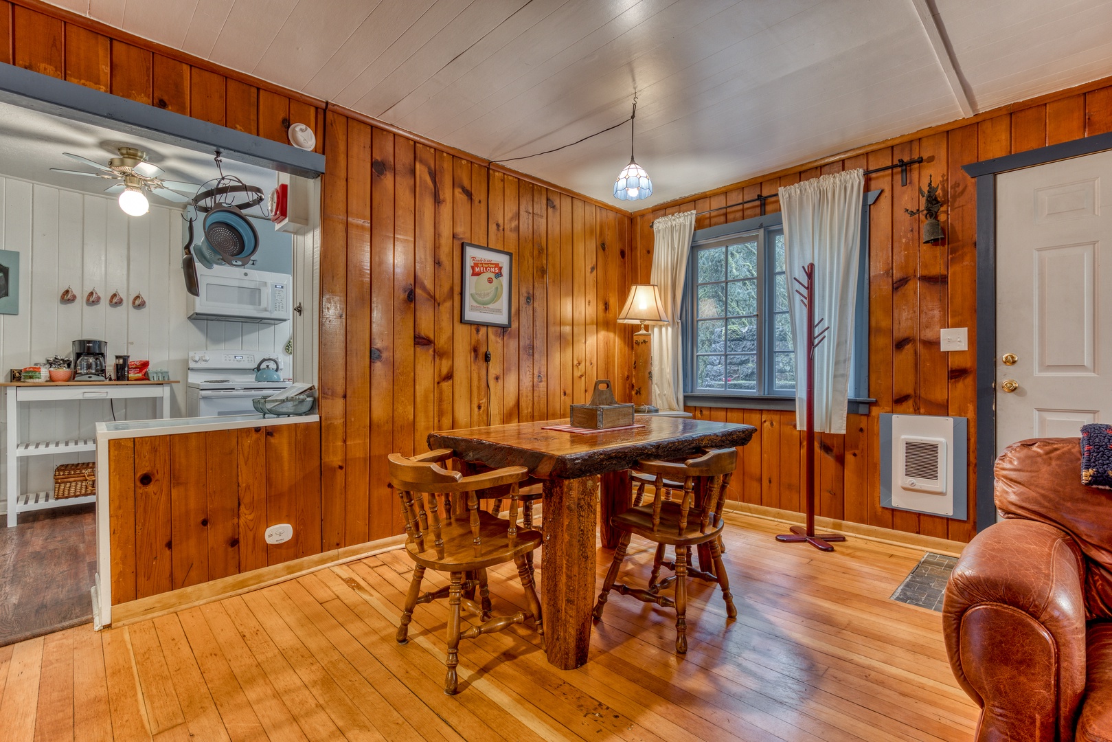 Brightwood Vacation Rentals, Springbrook Cabin - Enjoy your delicious meals at the custom-made heavy wood dining table for four guests.