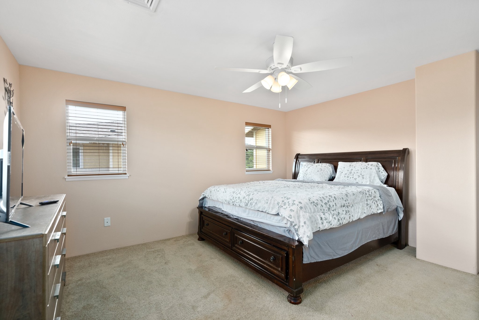 Kapolei Vacation Rentals, Kilipue Retreat - Spacious primary bedroom with king bed and natural light for a restful retreat.
