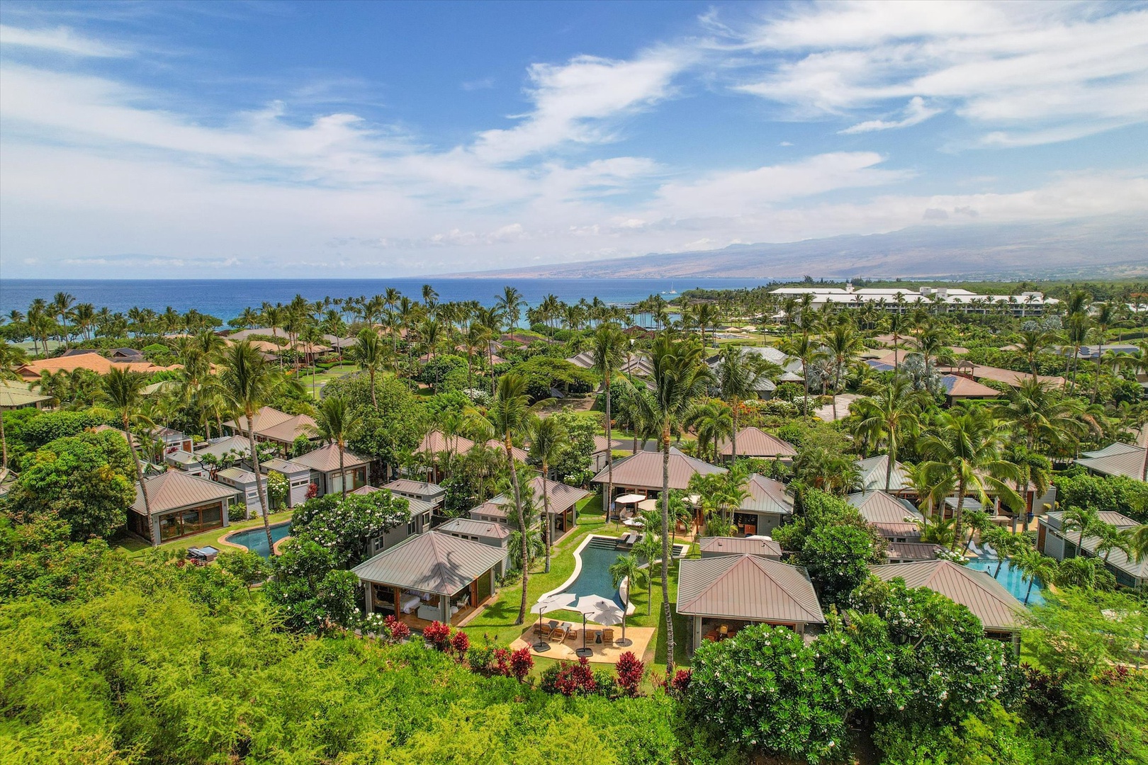 Kamuela Vacation Rentals, 3BD Na Hale 3 at Pauoa Beach Club at Mauna Lani Resort - Look past the rooftops and the coastline opens onto blue water in the distance.