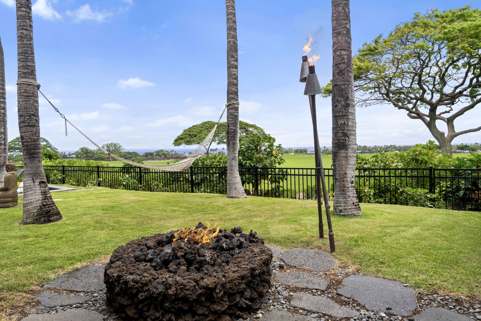 Kailua Kona Vacation Rentals, 3BD Pakui Street Estate (149) at Hualalai Resort - Gather around the stone firepit once the plates are cleared and the torches are lit.