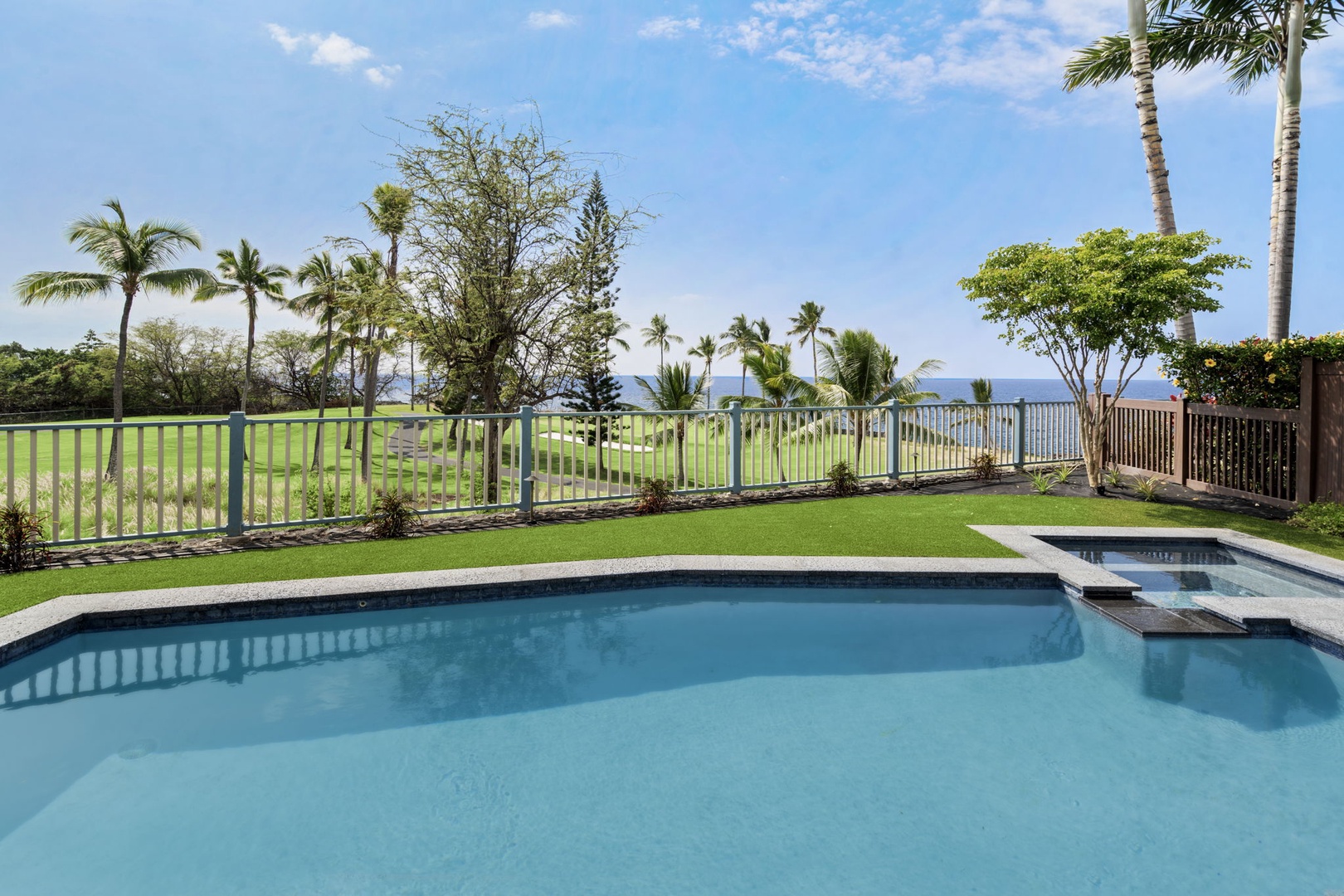 Kailua Kona Vacation Rentals, Holua Moana Hale - Unwind by the pool with breathtaking golf and ocean views.