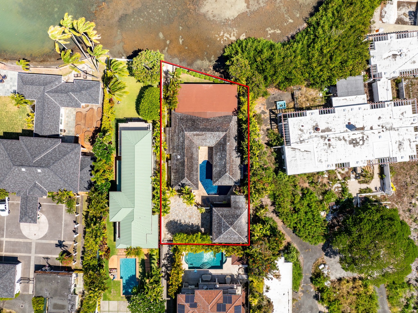 Honolulu Vacation Rentals, Honolulu Lagoonfront Villa - Bird’s-eye view of the home’s courtyard layout—four wings, central pool, and lush tropical landscaping throughout.