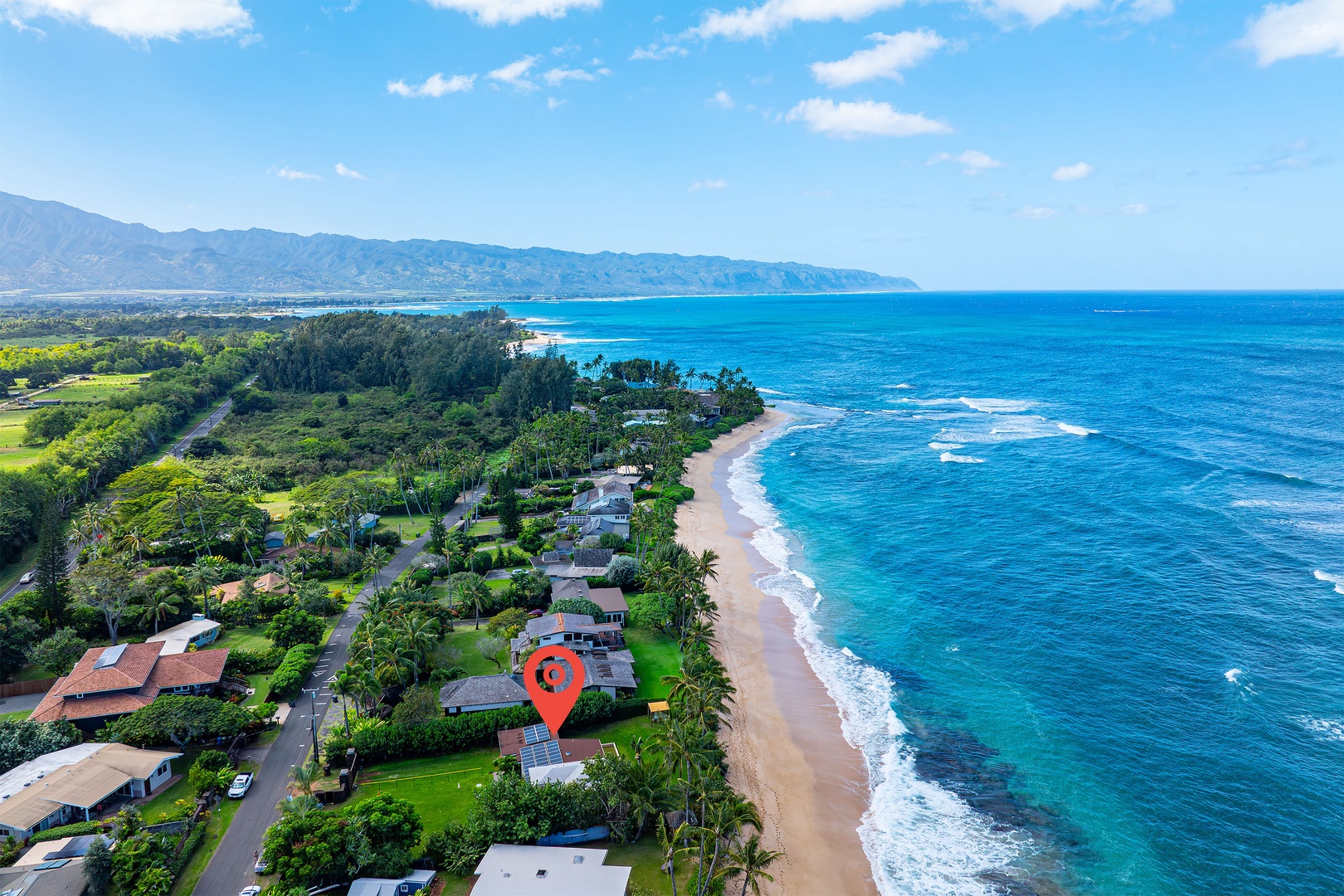 Haleiwa Vacation Rentals, North Shore Beachfront Resort - Coastal view showcasing a scenic neighborhood along the shore.