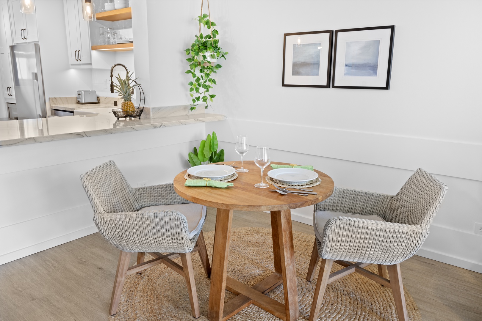 Honolulu Vacation Rentals, Hale Pono Waikiki - Savor meals and conversations at this charming dining table, beautifully set in a light-filled corner.