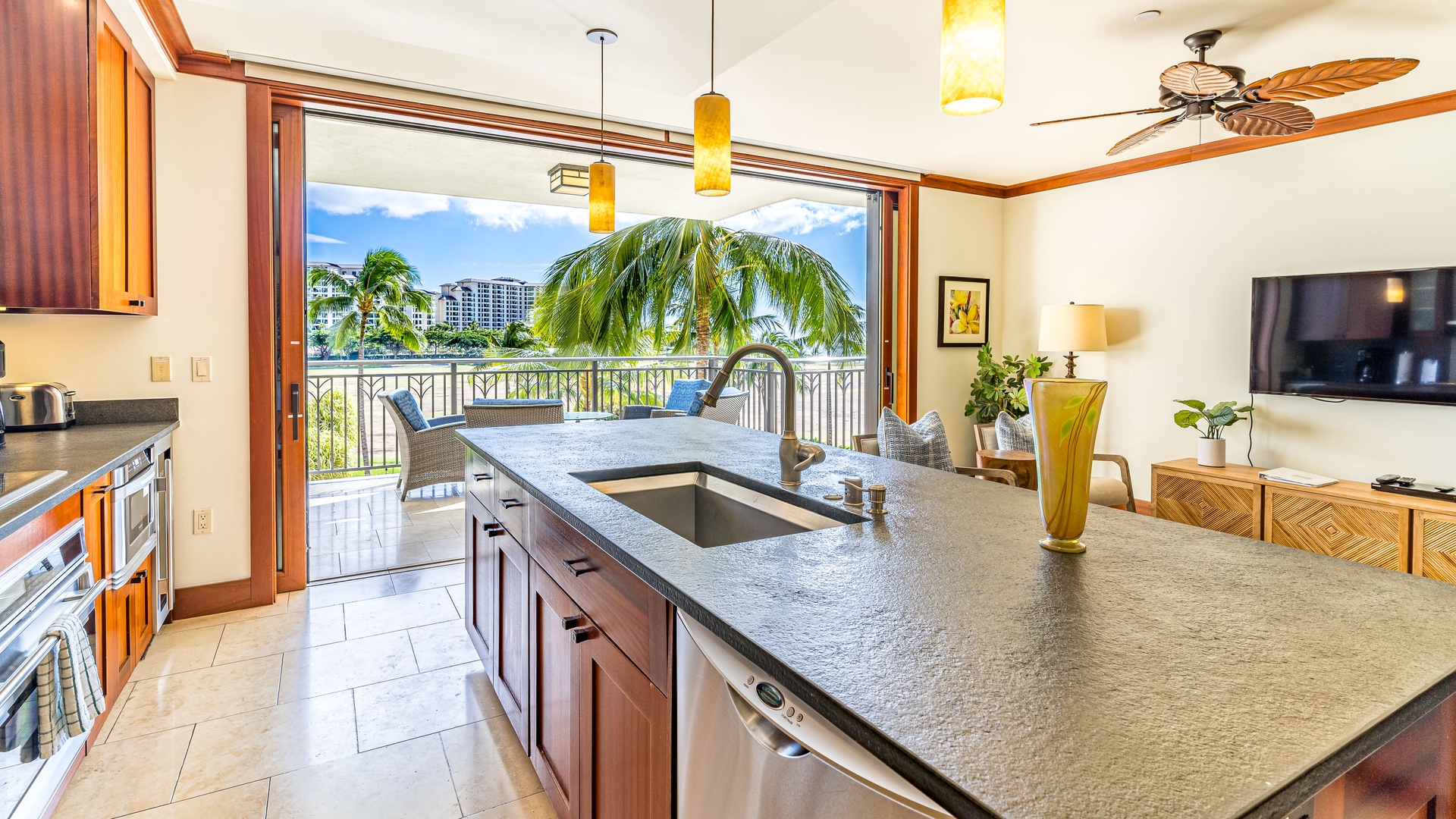 Kapolei Vacation Rentals, Ko Olina Beach Villas B403 - The Roy Yamaguchi designed kitchen with a lanai view.