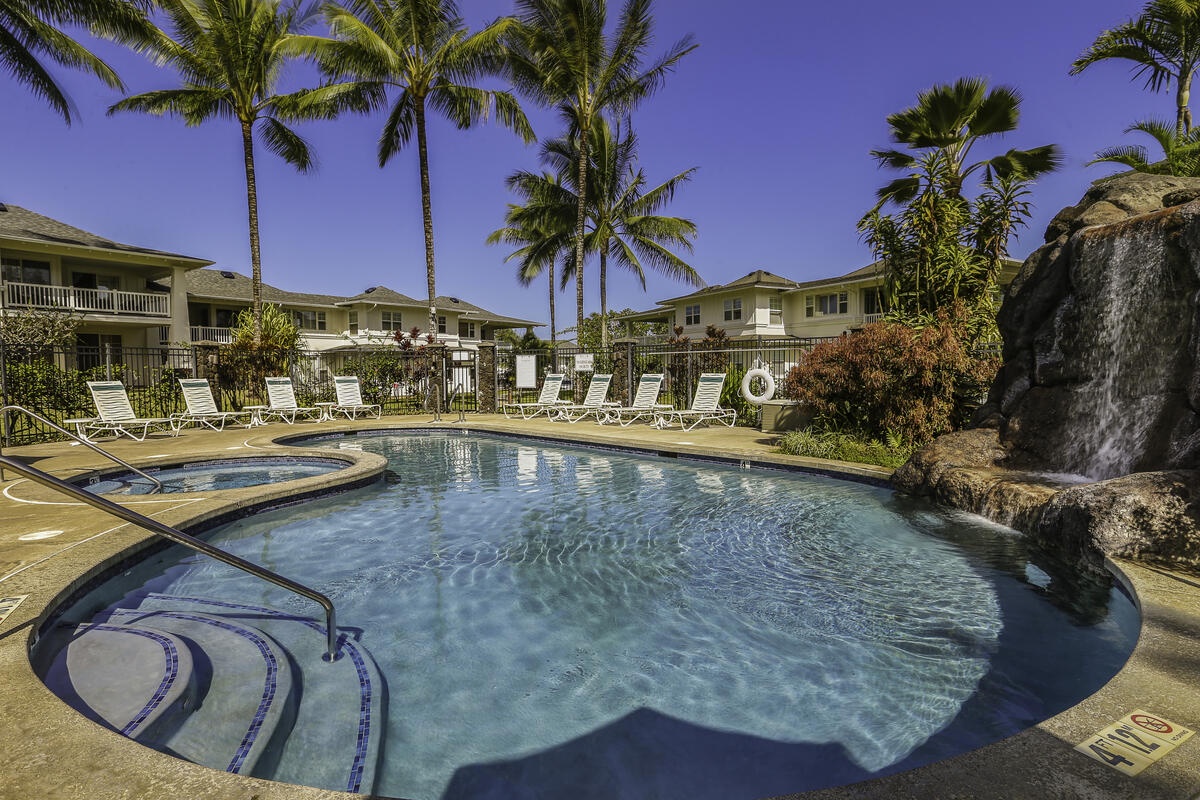 Princeville Vacation Rentals, Pili Aloha - Take a refreshing dip in the lagoon-style pool surrounded by palms.