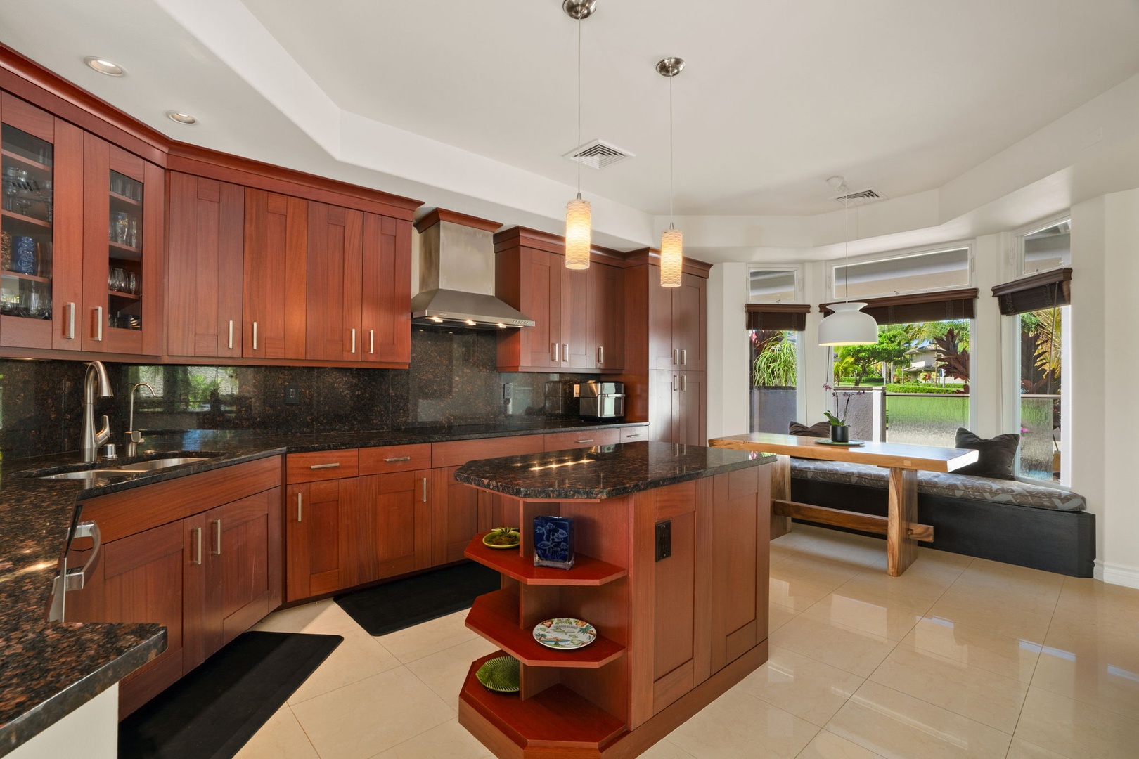 Princeville Vacation Rentals, Kaiulani #8 - Plenty of counter for a real dinner, with cherry cabinetry wrapping the whole kitchen.