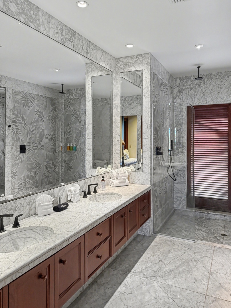 Kailua-Kona Vacation Rentals, Hahalua Bay Villa - Indulge in your luxurious marble bathroom featuring elegant dual vanities, rainfall shower, and sophisticated tropical-inspired tile for your daily spa ritual.