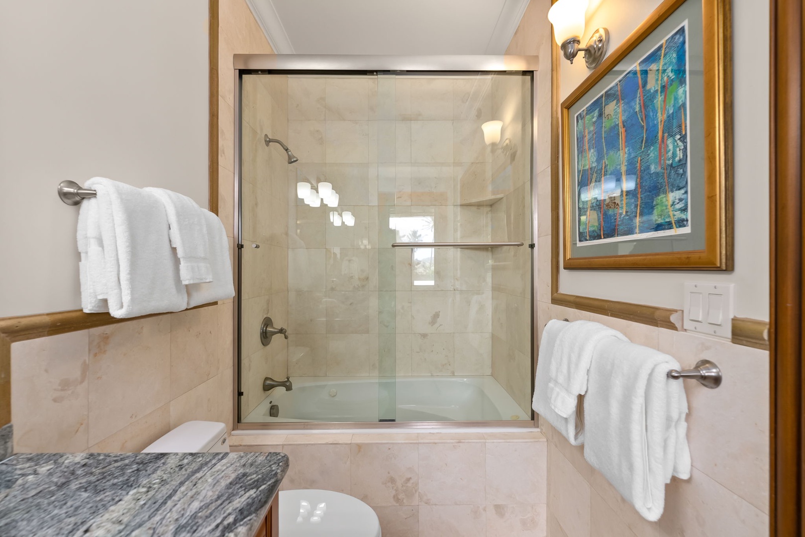 Honolulu Vacation Rentals, Maunalua Estate - A spacious glass shower and elegant stone finishes offer a refreshing start to each day.