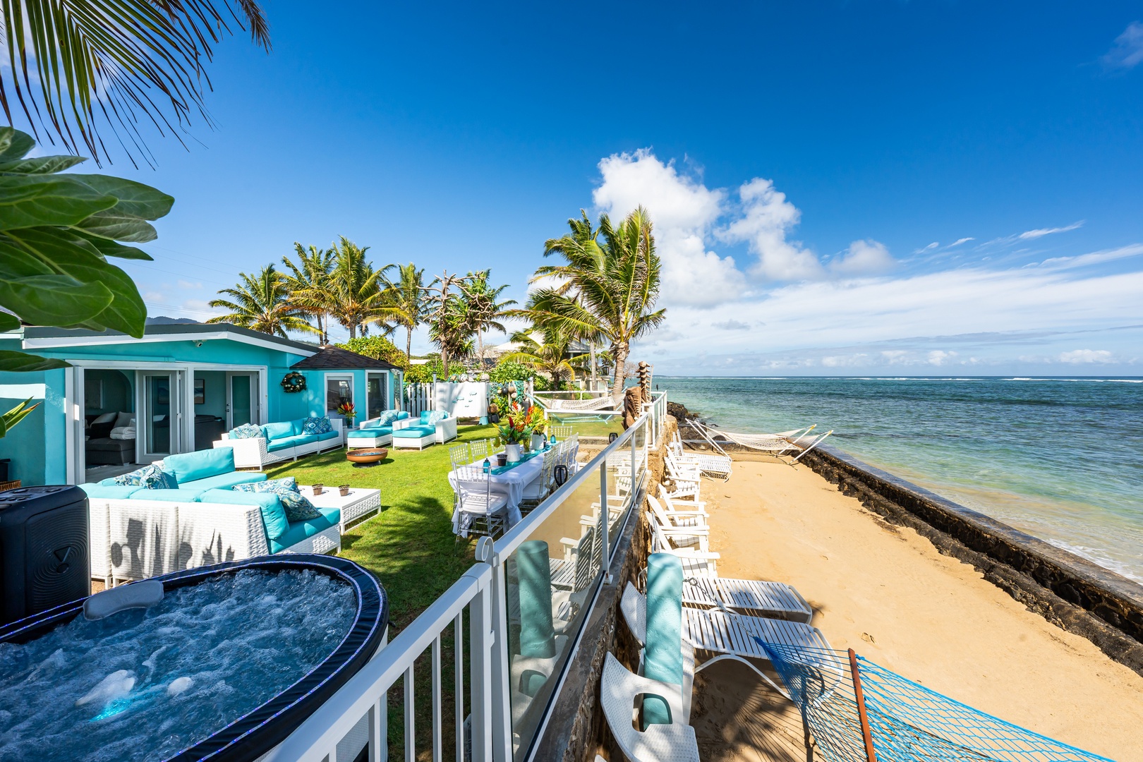 Hauula Vacation Rentals, Private Beach Paradise - Private beachfront setting with a hot tub, lush lawn, and direct access to the sand.