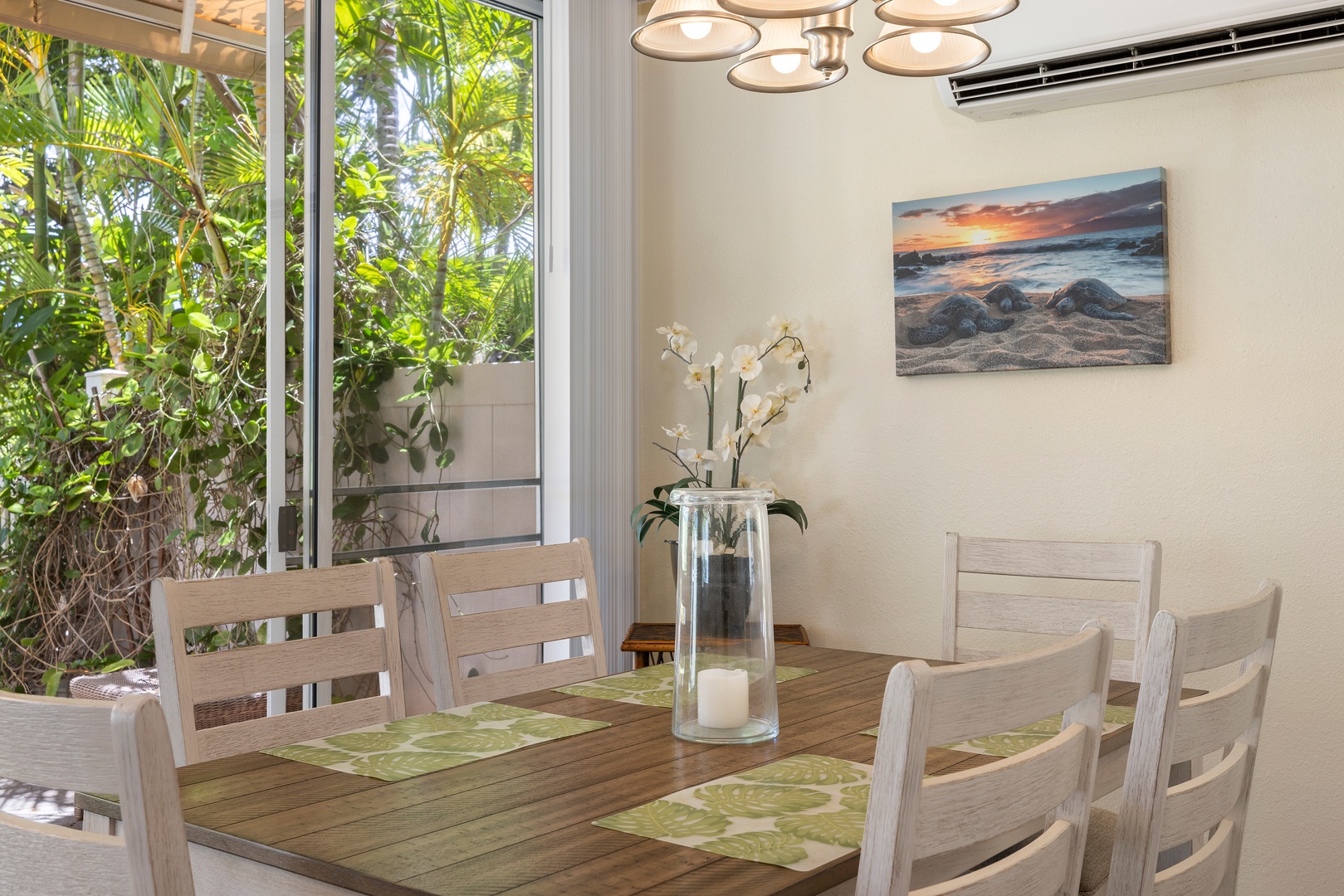 Your bright dining space opens to tropical gardens, perfect for memorable meals with modern comfort and natural beauty.