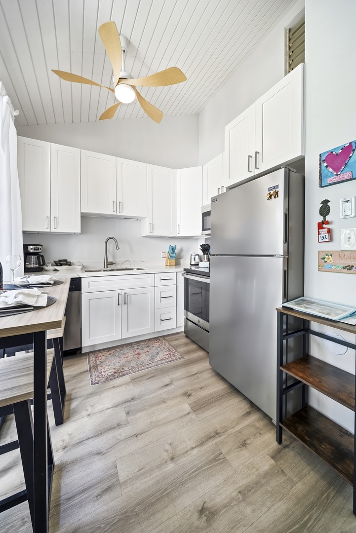 Kahuku Vacation Rentals, Kuilima Estates West #132 - A ceiling fan turns overhead while you cook beneath the studio's soaring white ceiling.