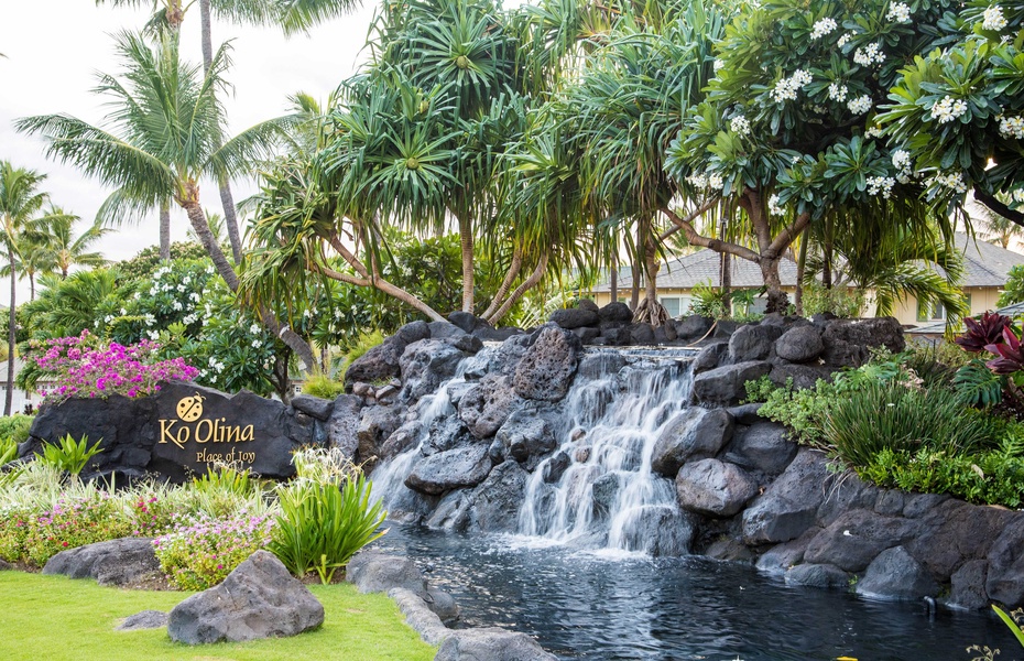 Kapolei Vacation Rentals, Fairways at Ko Olina 7A - Ko Olina's tropical entrance welcomes visitors with cascading waterfalls amid lush Hawaiian gardens and swaying palms.