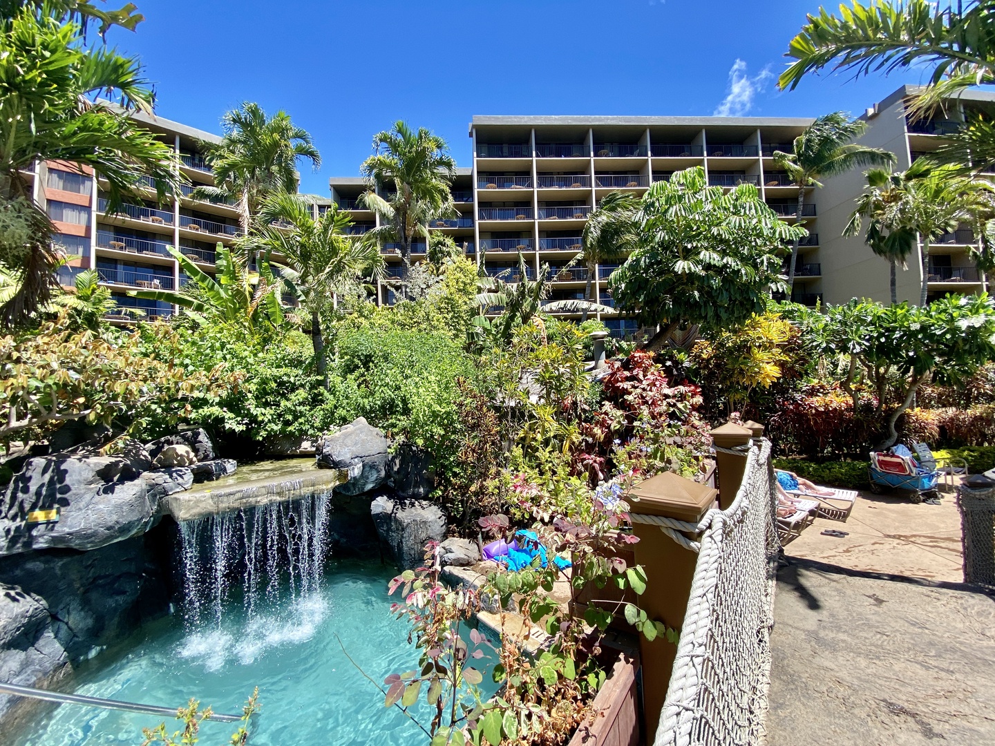 Lahaina Vacation Rentals, Kaanapali Shores 903 - The resort features lush tropical landscaping and serene waterfalls, creating a peaceful atmosphere for a relaxing island getaway.