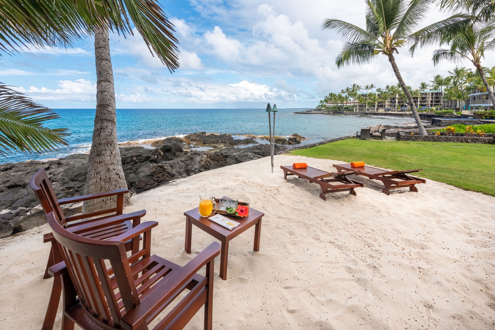 Kailua Kona Vacation Rentals, Kona Beach Bungalows** - Experience tranquility at Ocean Front Seating Area 2, where the waves become the soundtrack to your relaxation.
