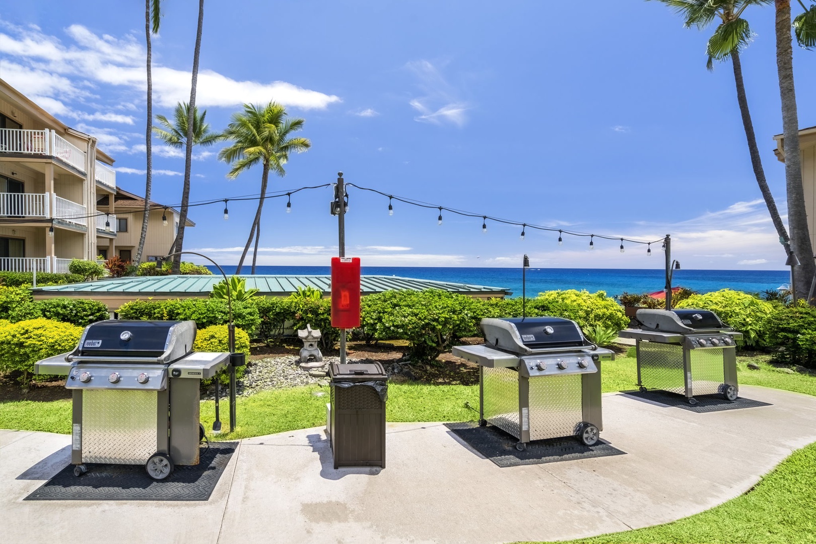 Kailua Kona Vacation Rentals, Sea Village 1105 - Community BBQs and picnic tables offer a scenic, social way to enjoy sunset dinners by the sea.