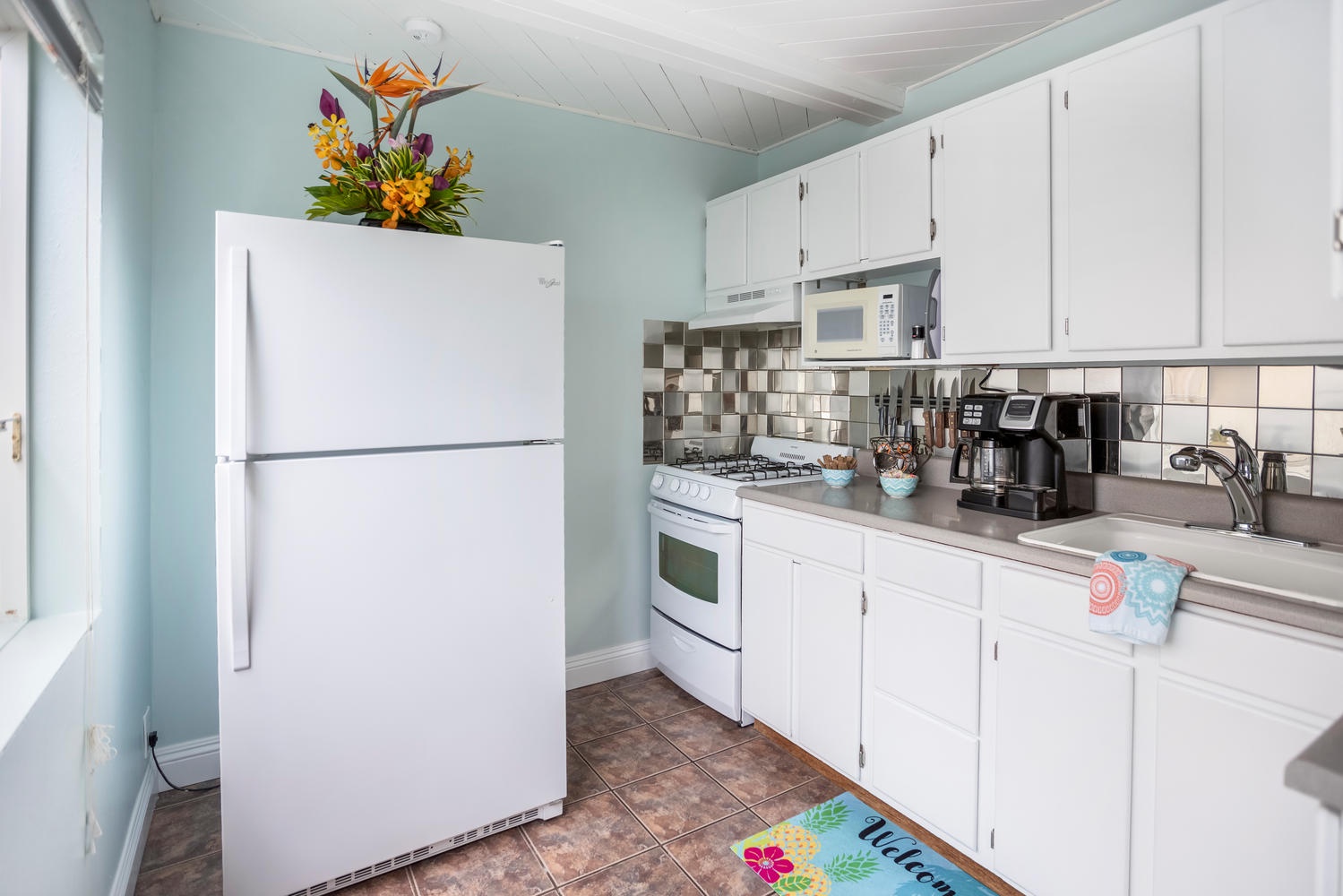 Princeville Vacation Rentals, Pineapple Suite - A well-lit kitchen space offering vintage charm with modern conveniences.