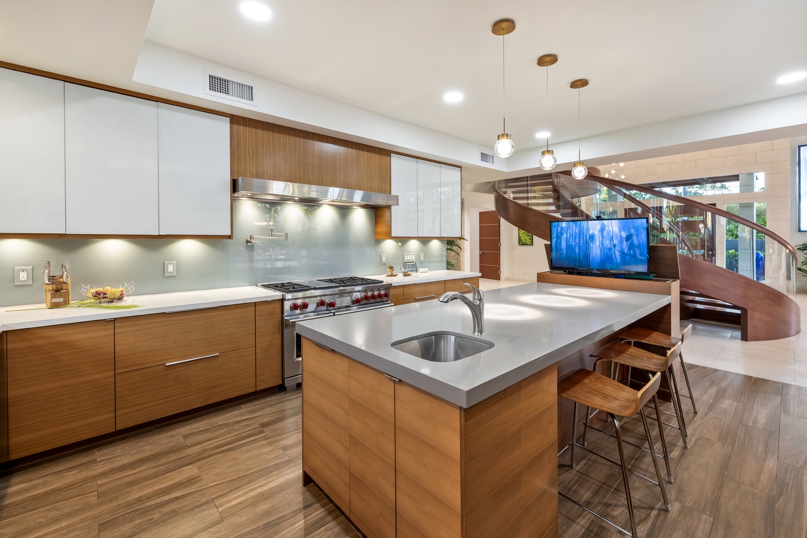 Honolulu Vacation Rentals, Kahala Grand Splendor - Chef’s kitchen with sleek finishes and a spacious island.