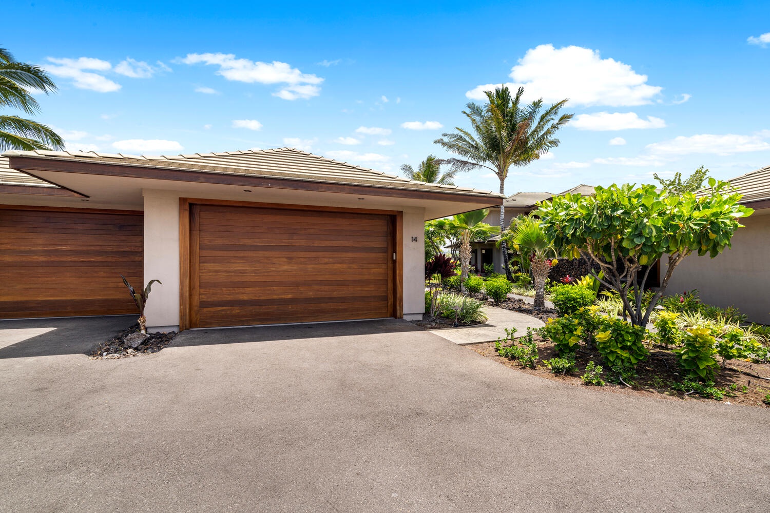 Kamuela Vacation Rentals, Laule'a at the Mauna Lani Resort #14 - Private driveway and garage with easy access for guests and gear.