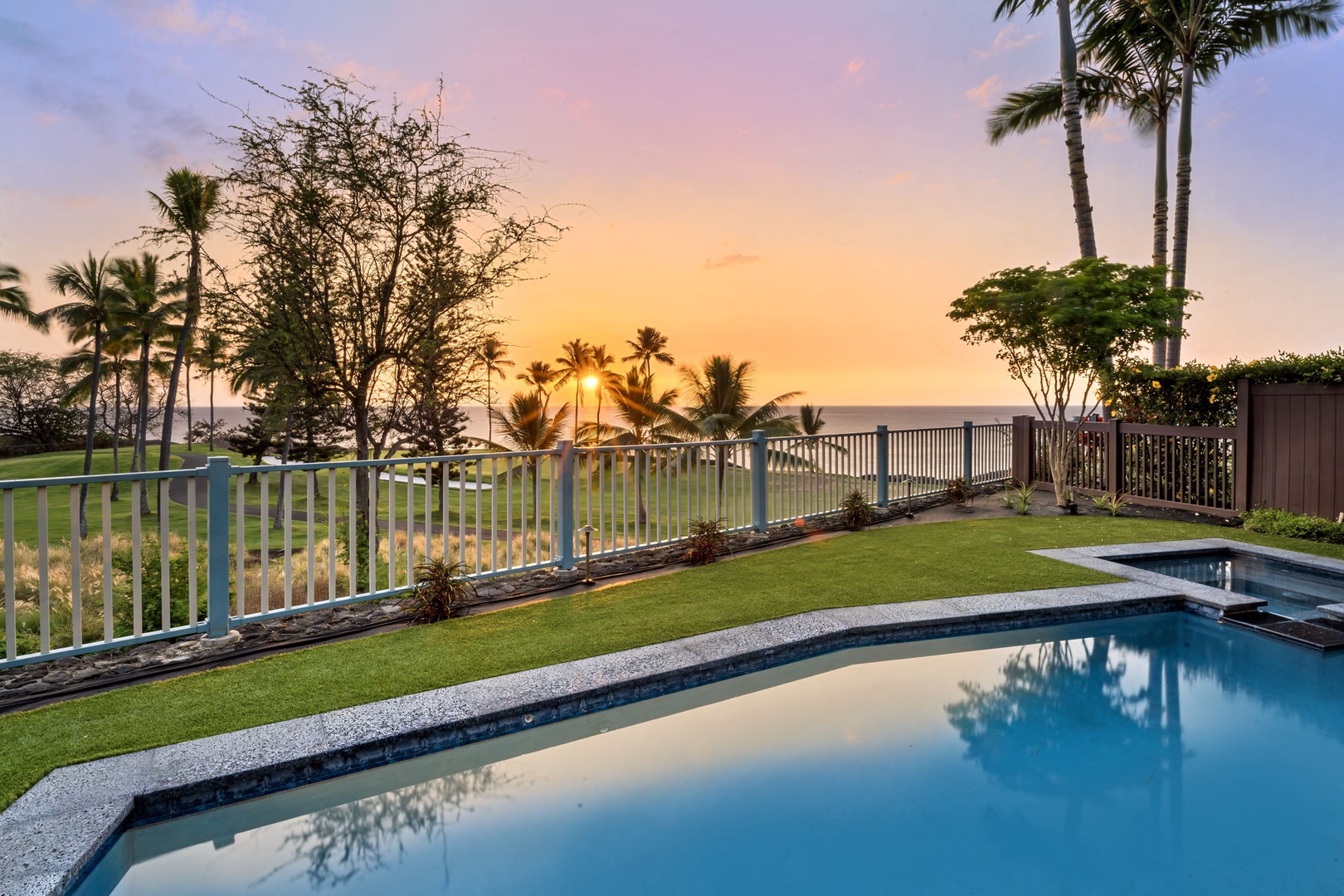 Kailua Kona Vacation Rentals, Holua Moana Hale - Relax poolside as the sky transforms with sunset hues.