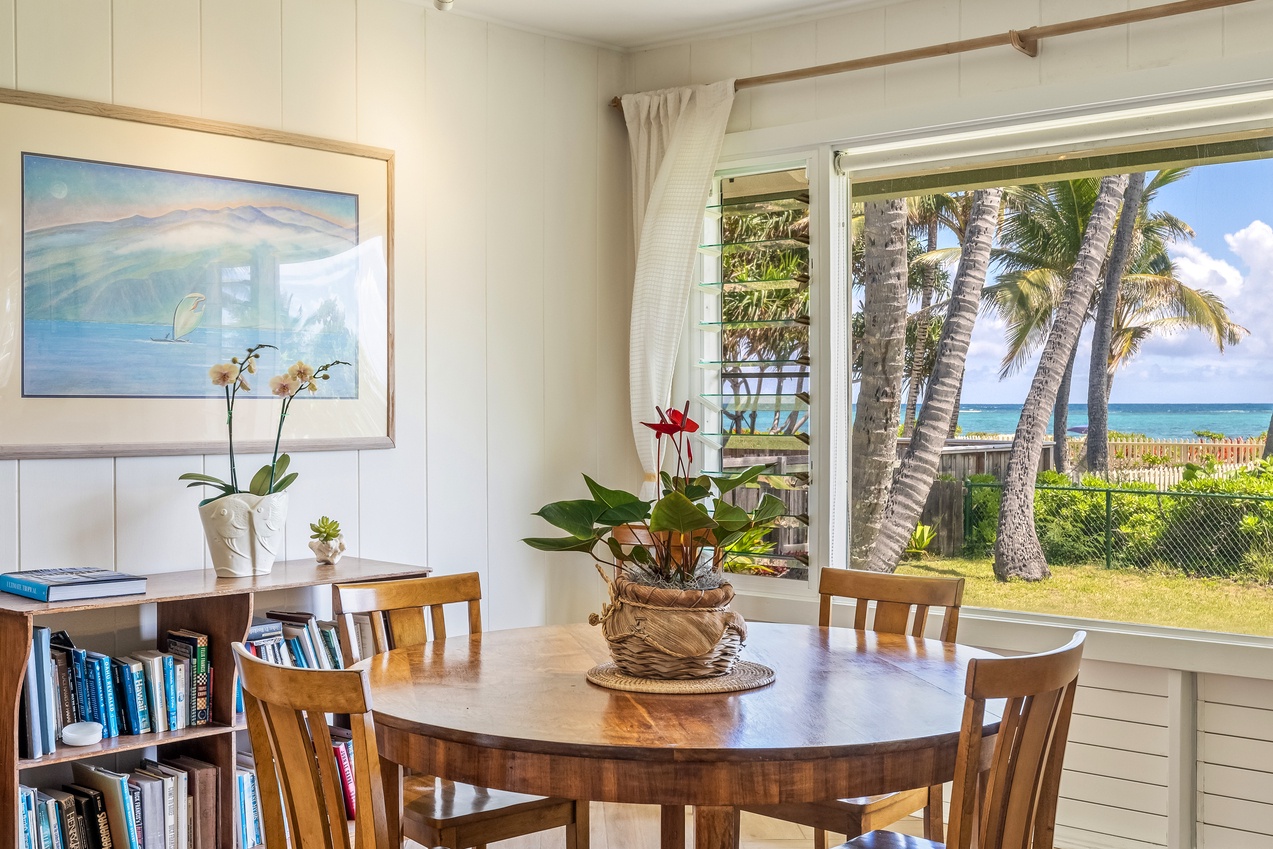 Kailua Vacation Rentals, Hale Moana Lanikai - Dine in serenity at this lovely table, beautifully set near the lanai offering tranquil views of lush greenery.