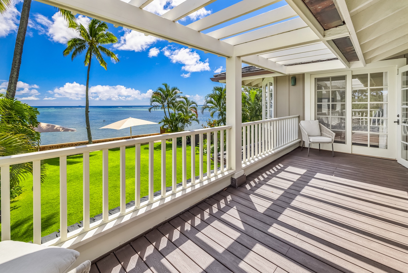 Honolulu Vacation Rentals, Moana Lani - Main House - Lean on the upstairs veranda rail for a long look over the lawn and out to sea.