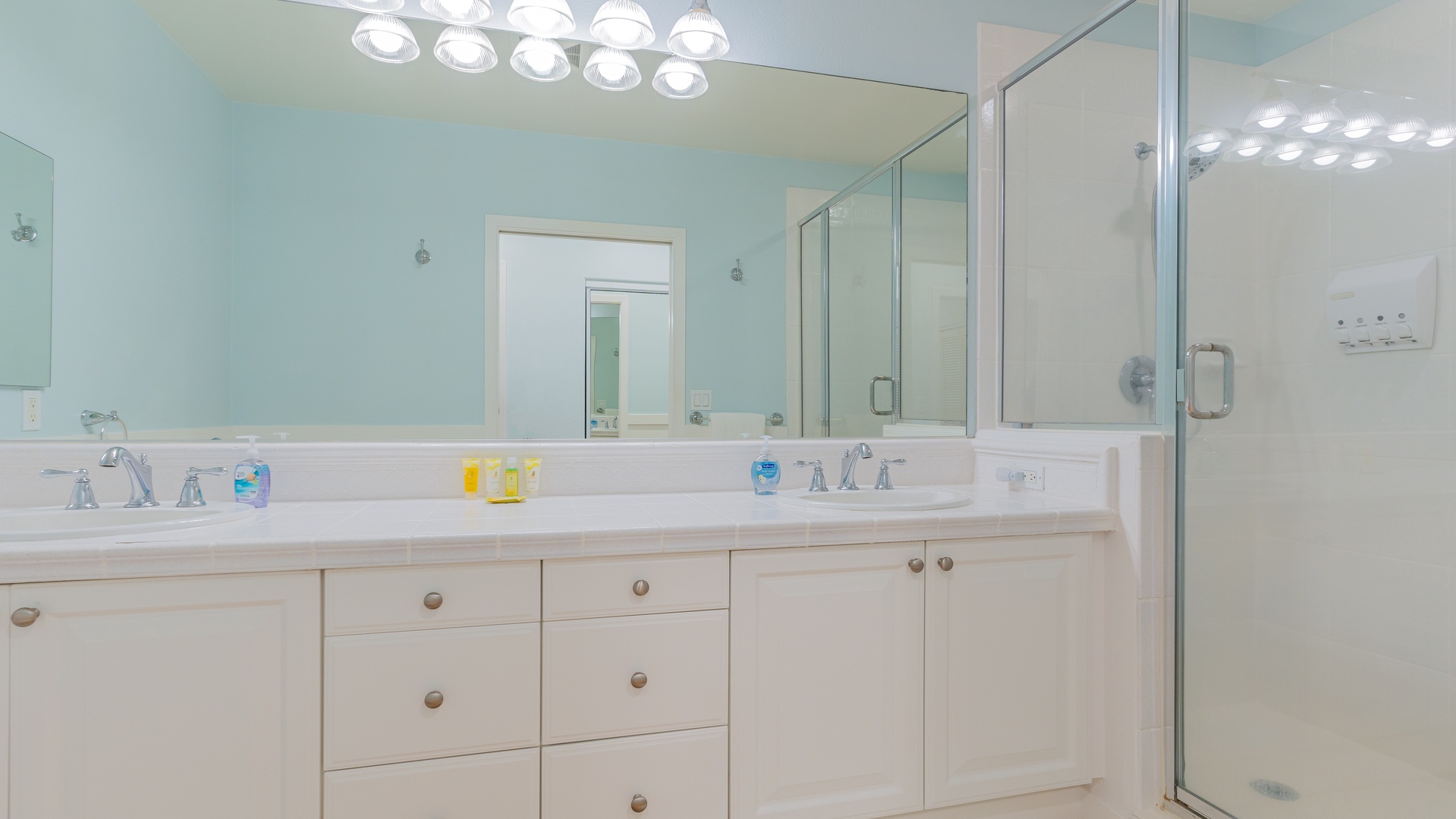 Kapolei Vacation Rentals, Coconut Plantation 1110-3 - The primary guest bathroom with a shower and ample lighting.