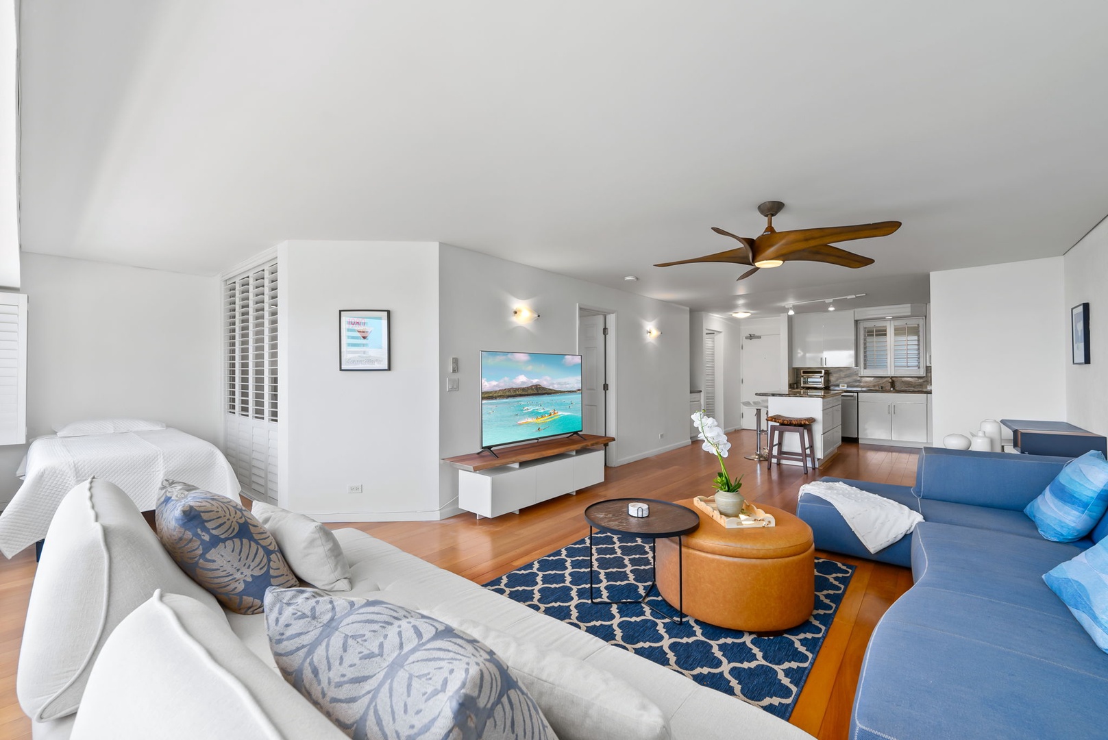 Honolulu Vacation Rentals, Colony Surf Retreat - A bright and open living area with modern coastal décor and hardwood floors—ideal for relaxing after Waikiki adventures.