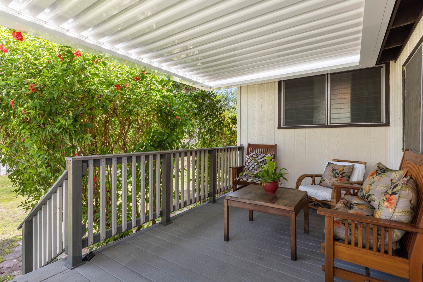 Ewa Beach Vacation Rentals, Ewa Beachfront Cottage - The covered lanai is a perfect spot to sip your morning coffee.