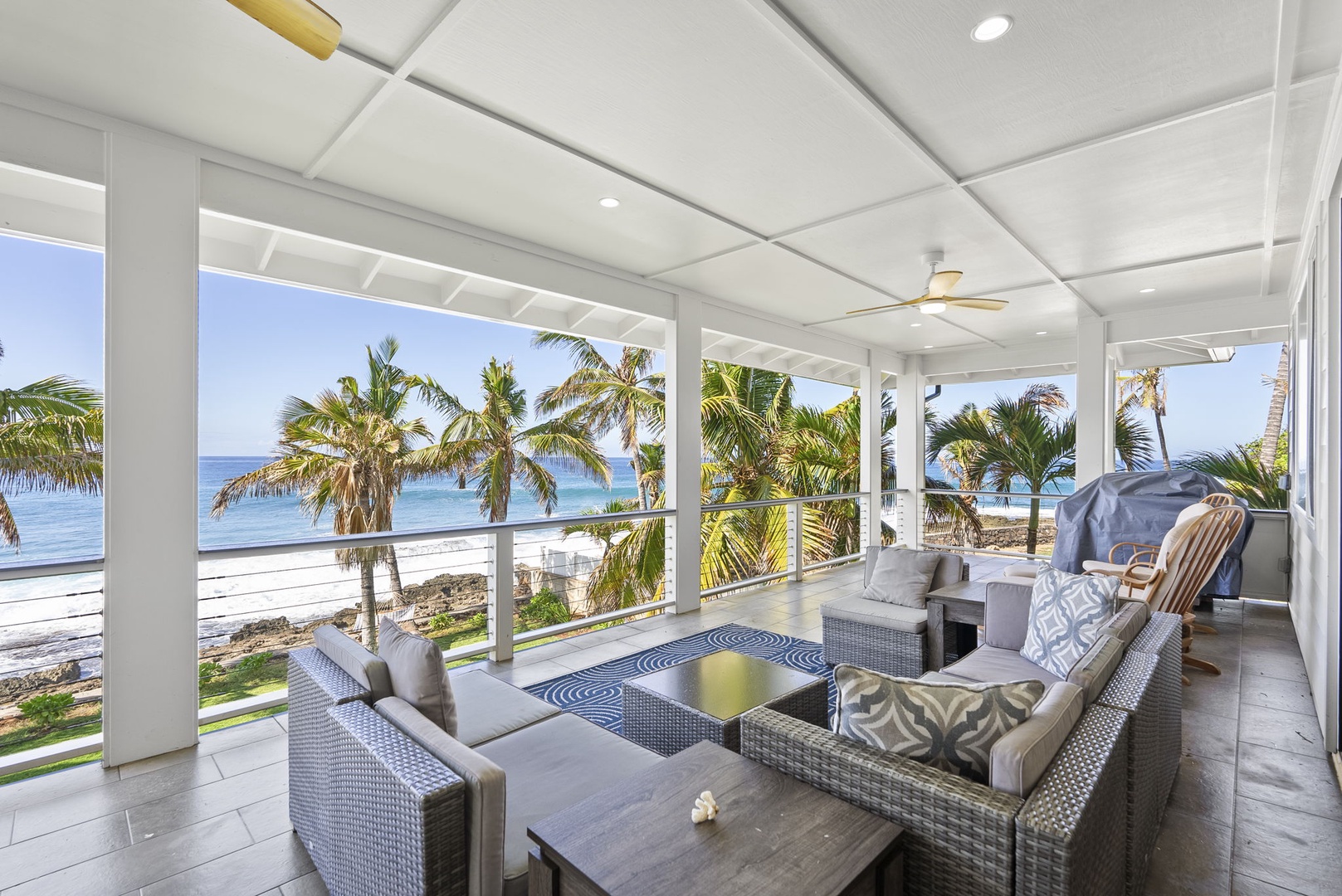 Waianae Vacation Rentals, Oceanfront Luxury Dream Estate - Spacious upper lanai with plush seating and panoramic coastal views.