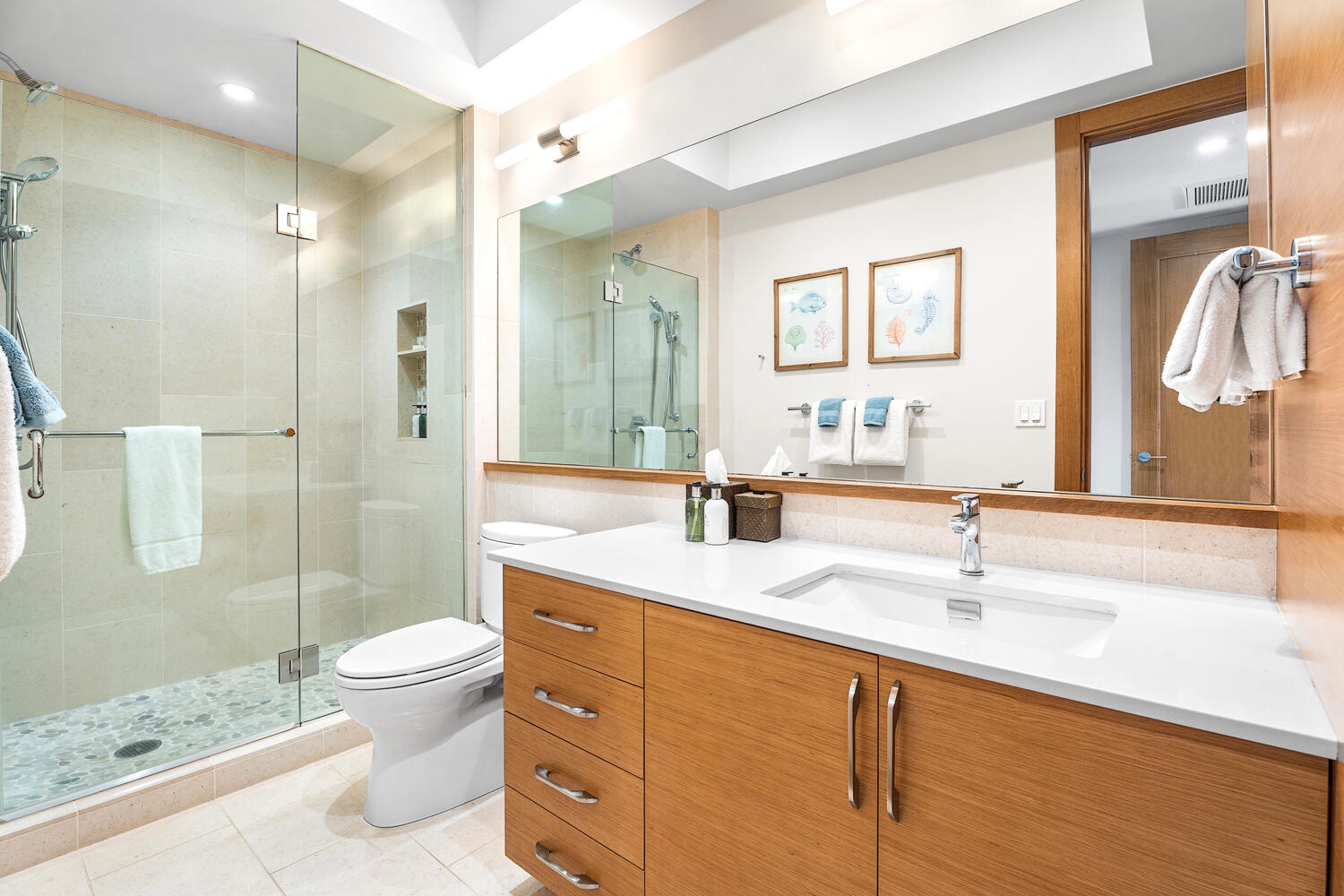 Kamuela Vacation Rentals, Laule'a at the Mauna Lani Resort #14 - Elegant bathroom with walk-in glass shower and sleek vanity.