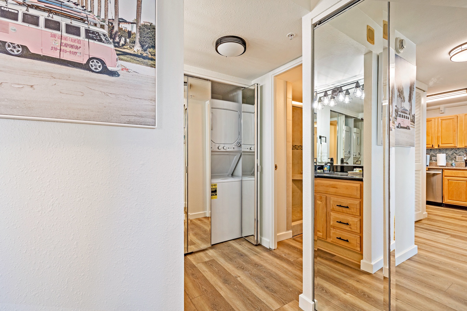 Lahaina Vacation Rentals, Mahana 718 - This hallway features mirrored closet doors that conceal a convenient in-unit washer and dryer, making laundry a breeze.