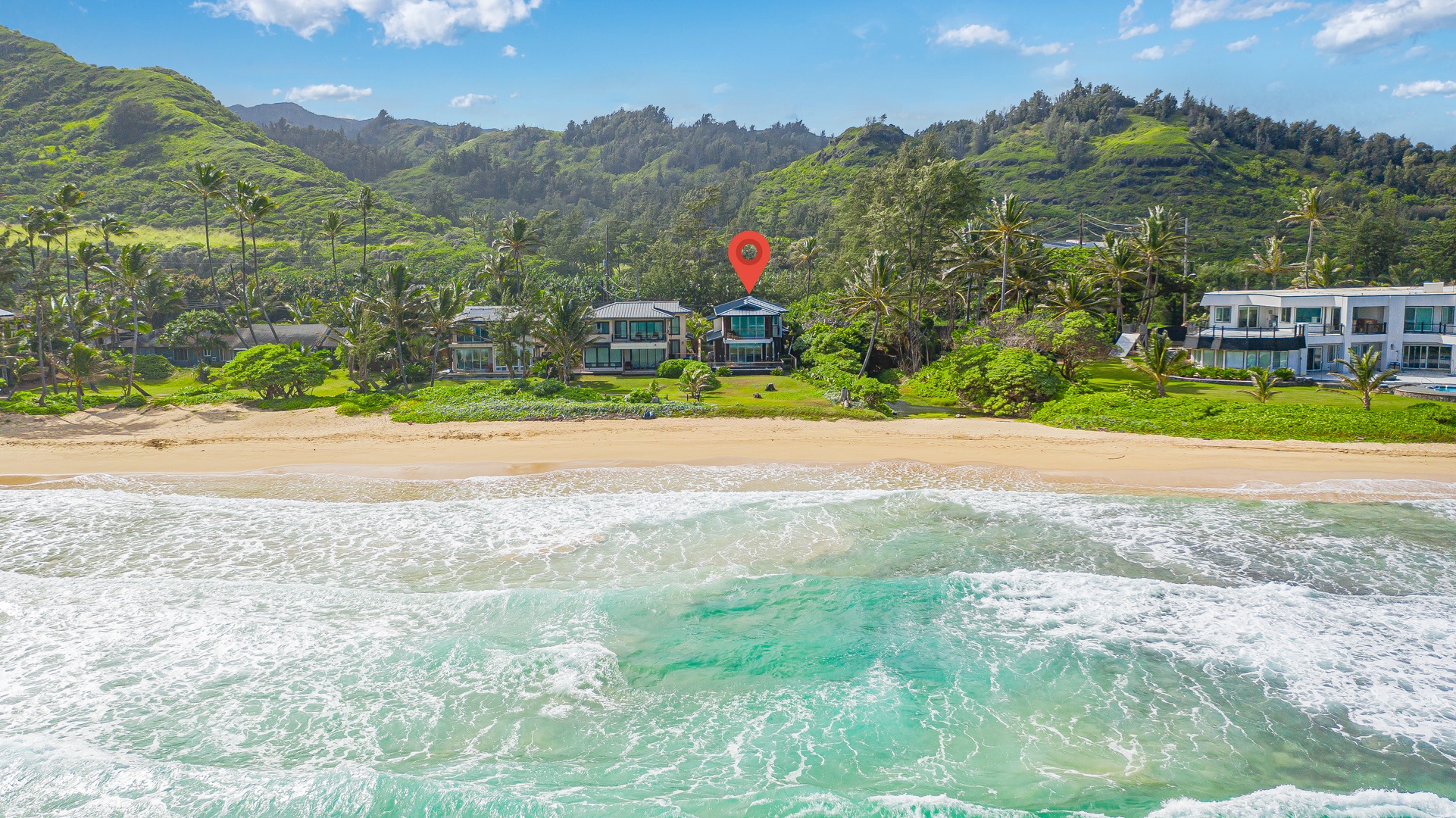 Laie Vacation Rentals, Majestic Mahakea Oceanfront Oasis - Sweeping view of the property nestled between the vibrant ocean and serene mountains.