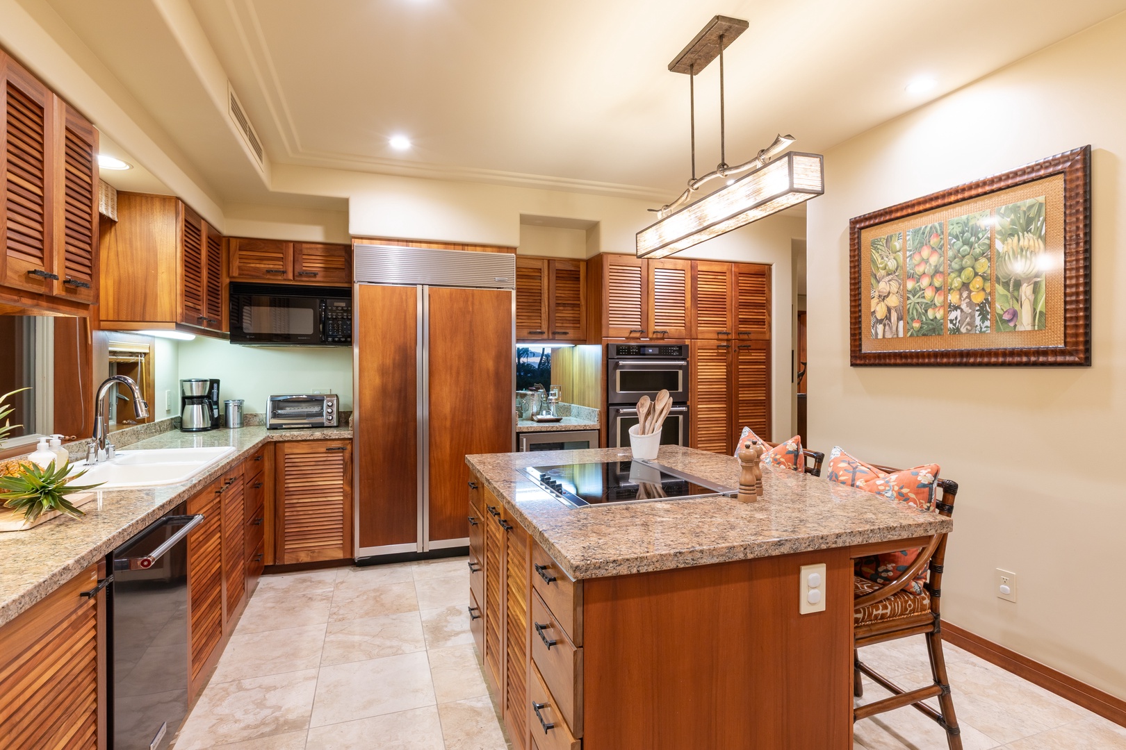 Kailua Kona Vacation Rentals, 2BD Hillside Villa (4102) at Hualalai Resort - Warm wood cabinetry and high-end appliances create an inviting culinary space.