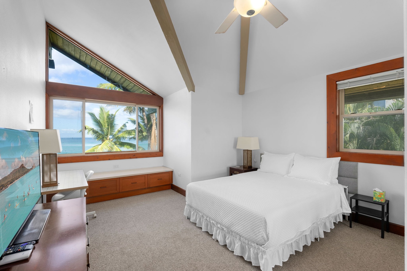 Waianae Vacation Rentals, Konishiki Beachhouse - 4BD - Guest bedroom with vaulted ceilings, ocean views, and natural light.