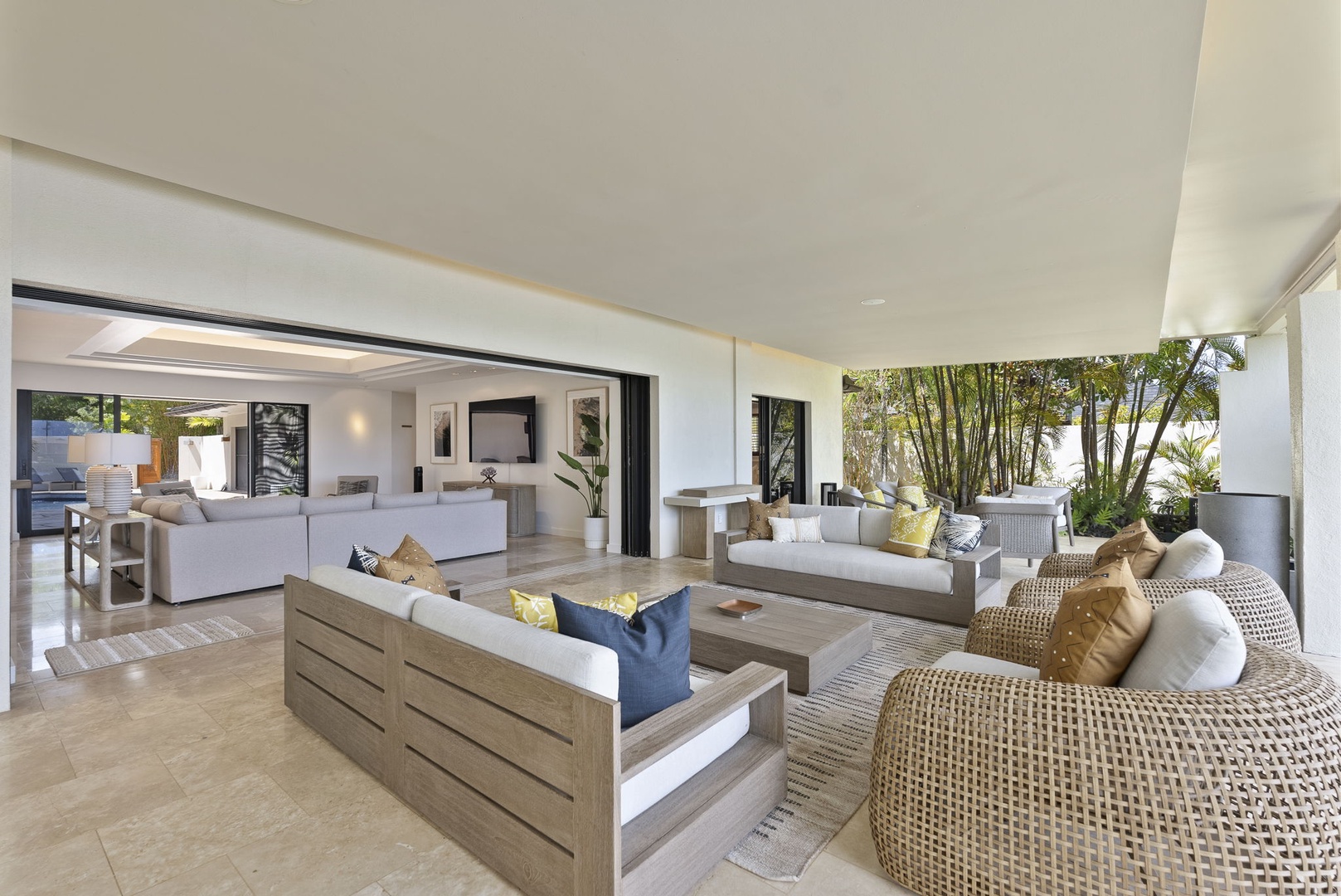 Honolulu Vacation Rentals, Honolulu Lagoonfront Villa - Seamless indoor-outdoor living with multiple seating areas for groups.