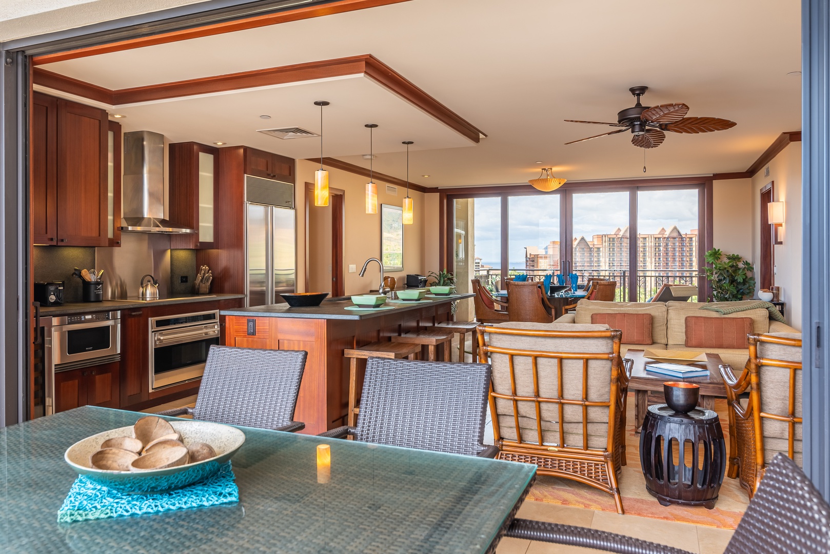 Kapolei Vacation Rentals, Ko Olina Beach Villas O1111 - The kitchen and living area with an open floor plan.