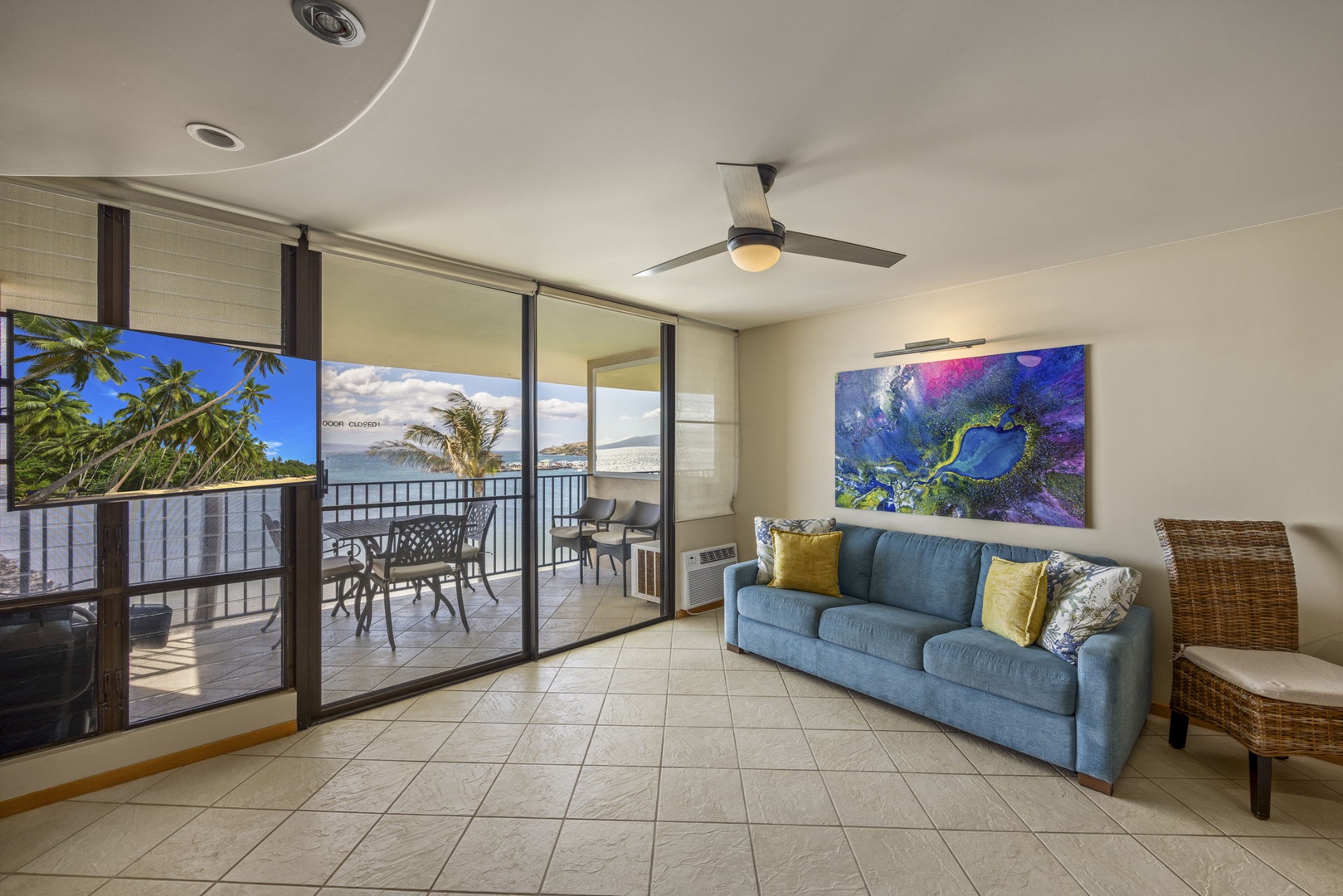 Wailuku Vacation Rentals, Milowai 310 - Step through the sliding glass doors, past the abstract painting, and you're on the lanai.