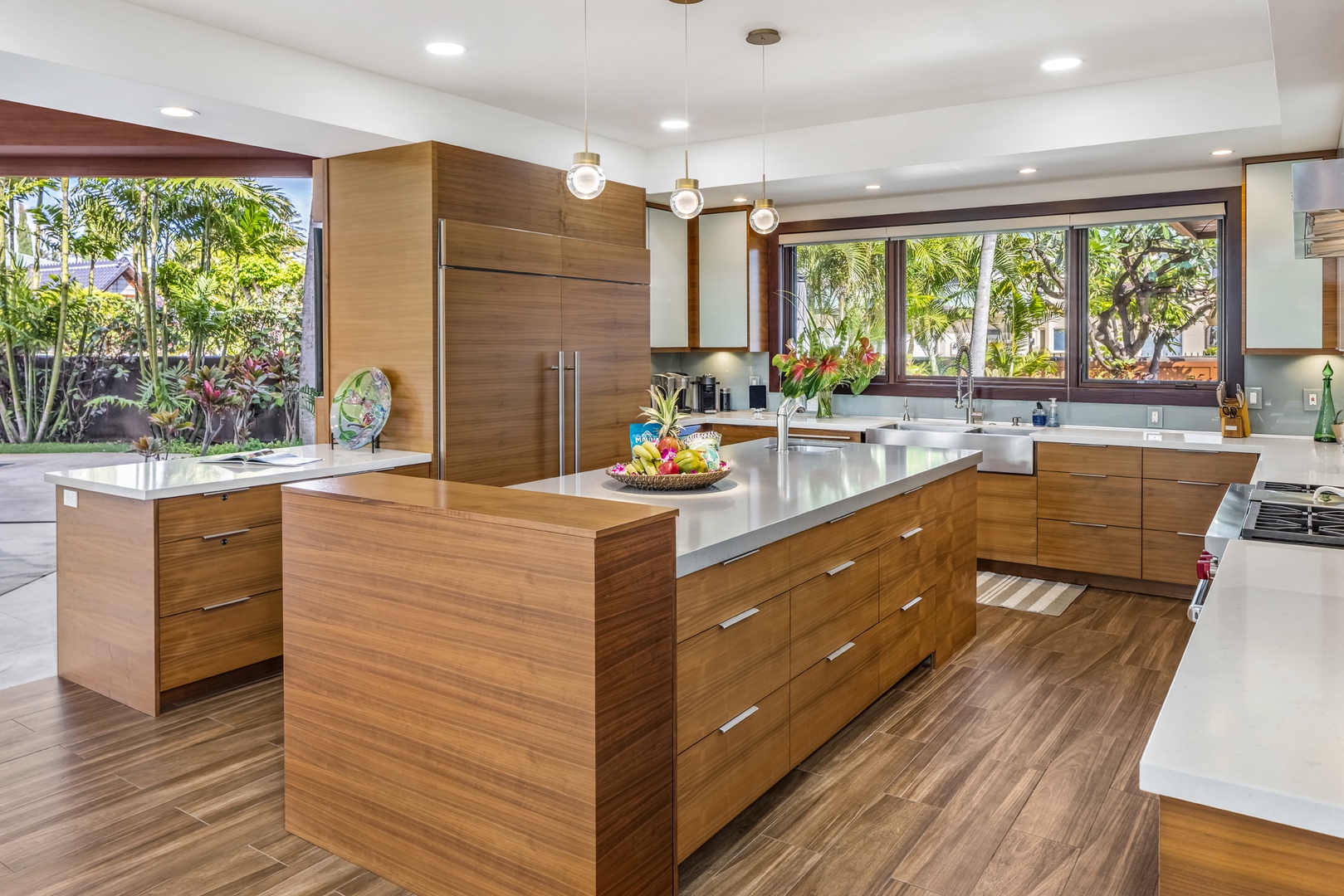 Honolulu Vacation Rentals, Kahala Grand Splendor - Prepare meals with ease in the modern and fully equipped kitchen with garden and pool views.