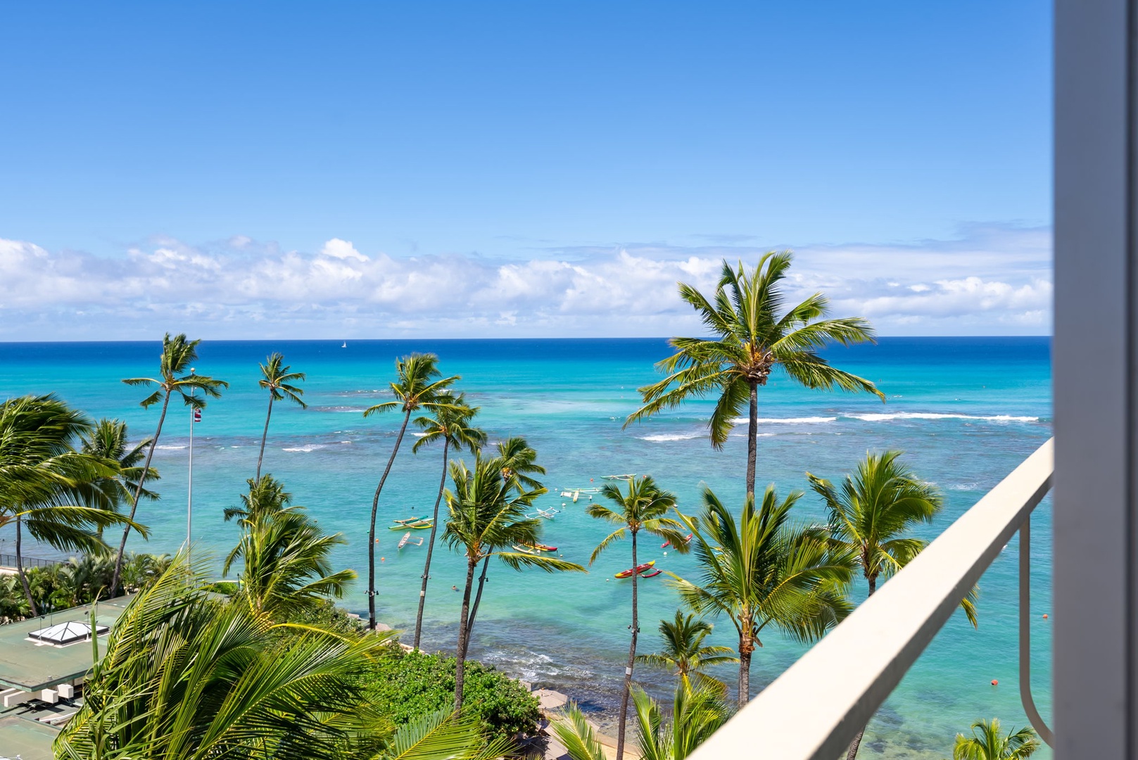 Honolulu Vacation Rentals, Colony Surf Getaway - Relaxing balcony offering expansive tropical views for a serene and exclusive getaway.