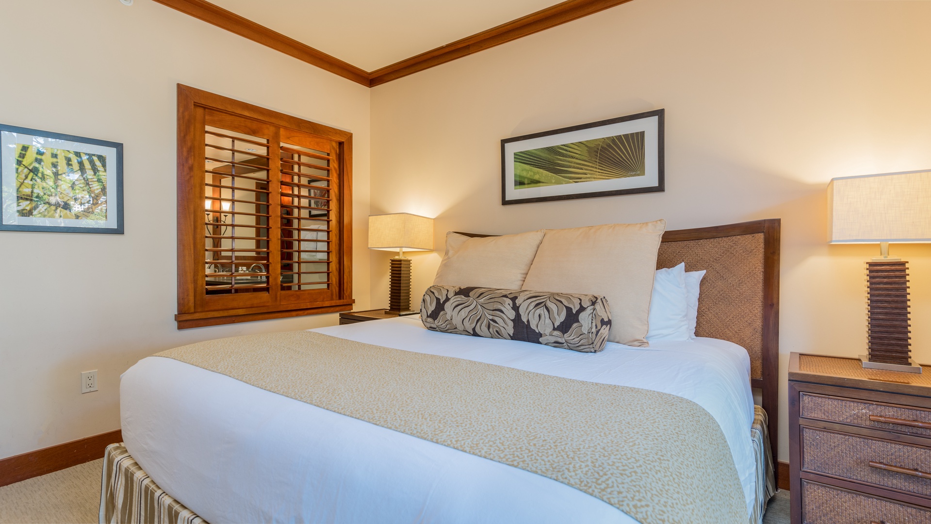 Kapolei Vacation Rentals, Ko Olina Beach Villas B202 - Welcome to your primary guest bedroom with luxurious linens and framed art.