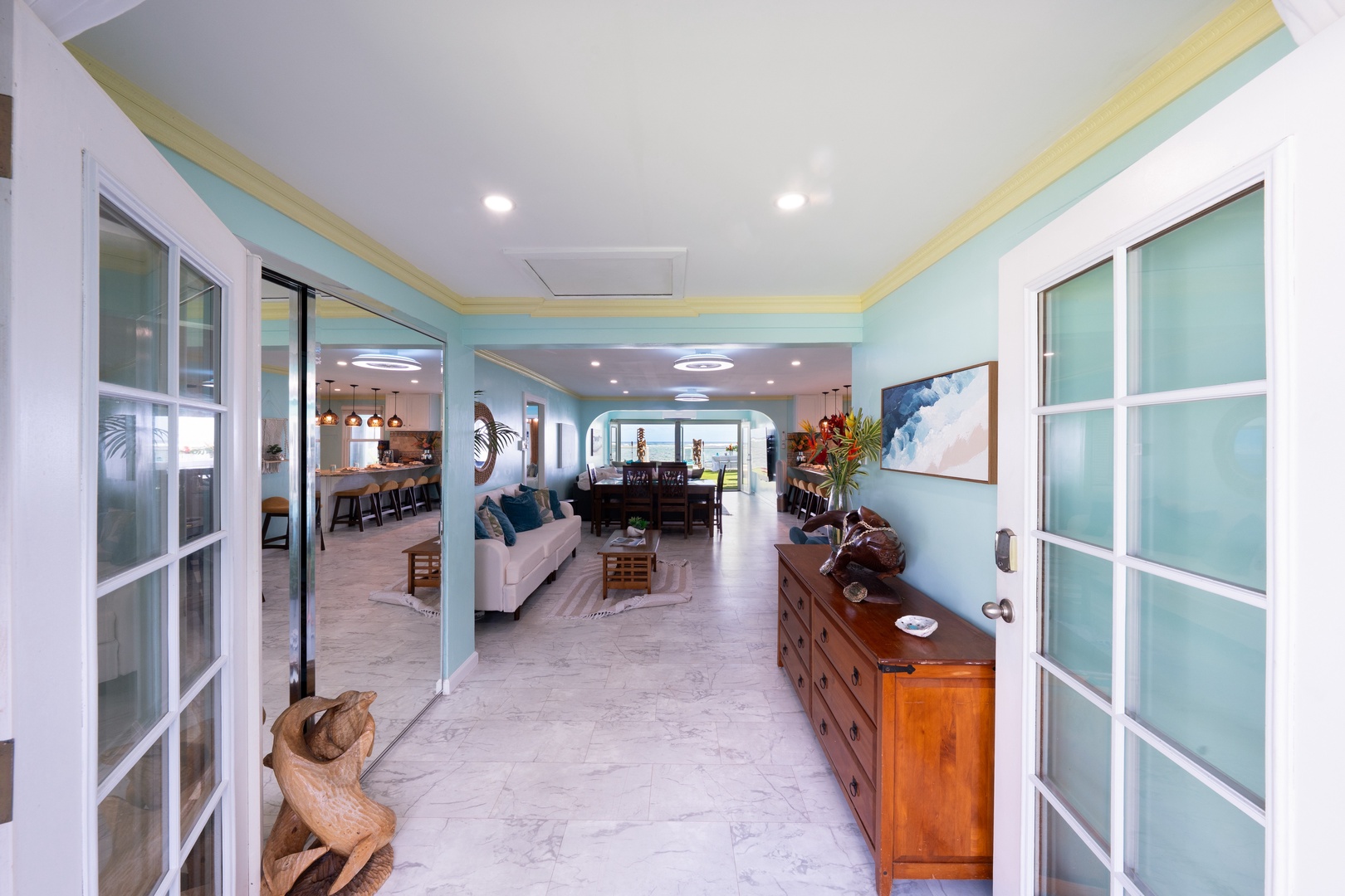 Hauula Vacation Rentals, Private Beach Paradise - Breezy entry through glass doors into a light-filled, open coastal retreat.