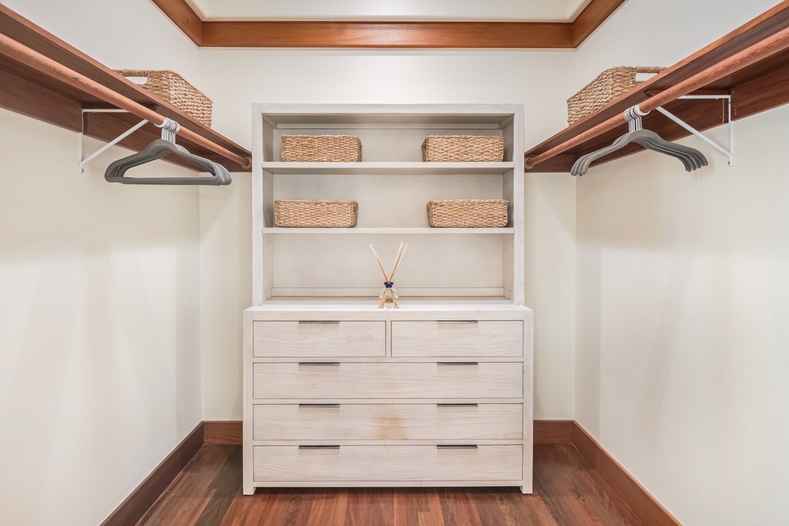 Kamuela Vacation Rentals, Champion Ridge Elegance - The primary bedroom's spacious walk-in closet showcasing a large dresser and ample space for all your vacation attire.