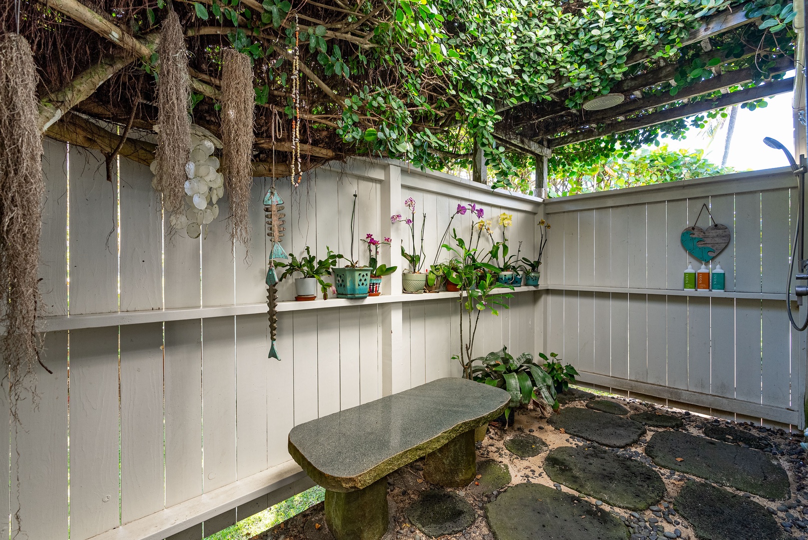 Haleiwa Vacation Rentals, Maluhia Beach House - Charming outdoor shower surrounded by lush greenery for a true island experience.