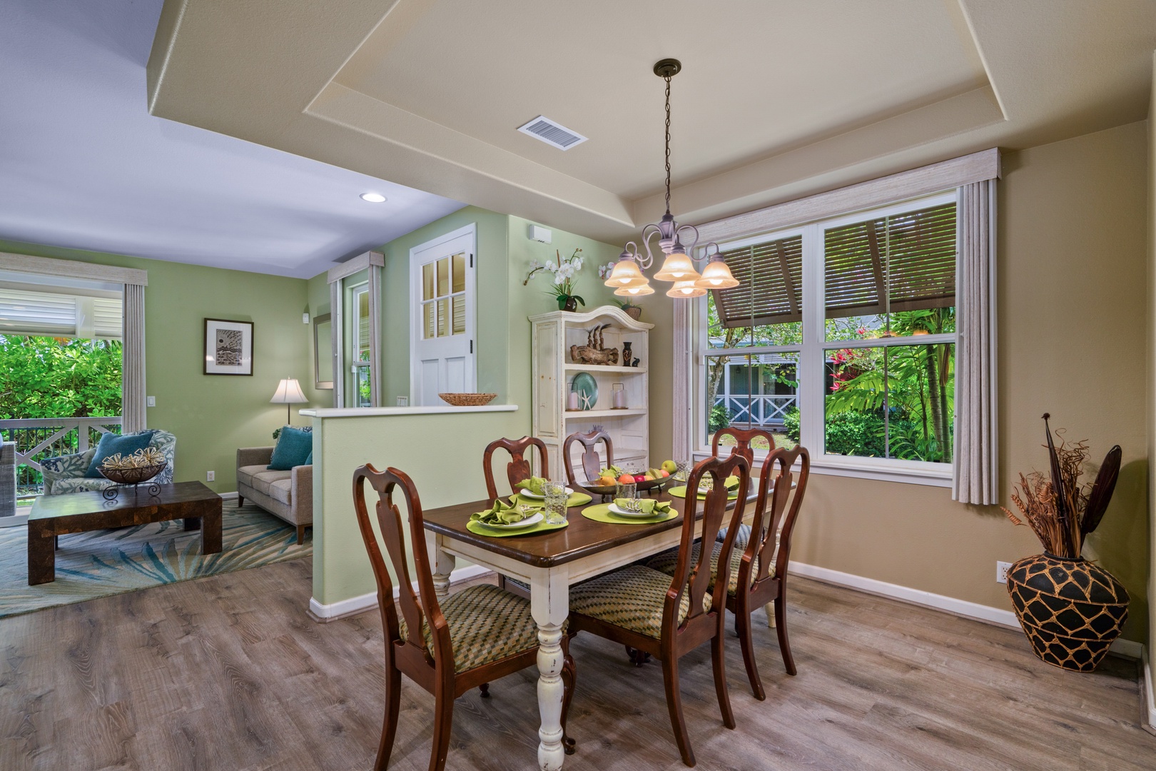 Princeville Vacation Rentals, Kaimana Villa - Gather around your elegant dining table overlooking lush tropical gardens, where memorable meals await in this bright, airy space.