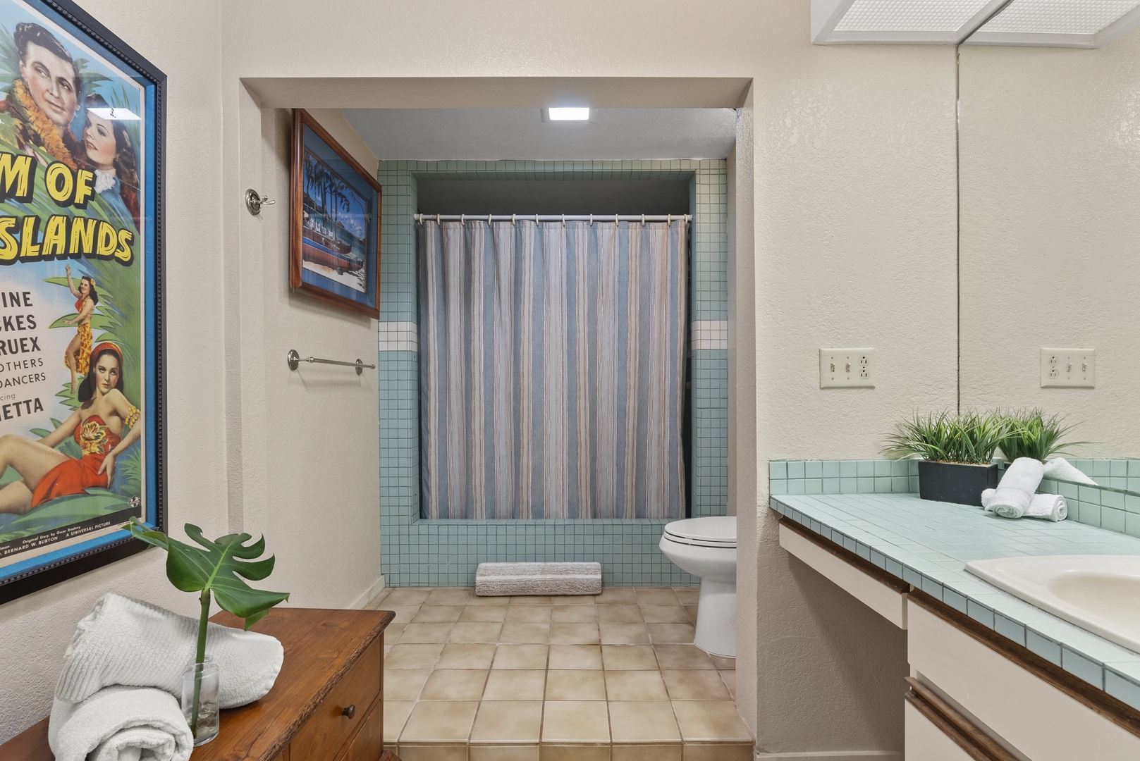 Haleiwa Vacation Rentals, North Shore Beachfront Retreat - Bathroom featuring a tub with a retro tile design.