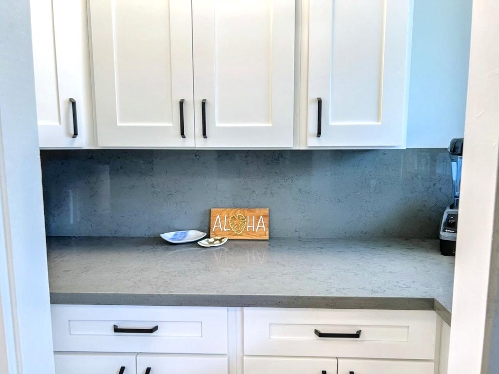 Kailua Vacation Rentals, Lanikai Cottage - A stylish kitchen with sleek cabinetry and fresh finishes, making meal prep a breeze during your stay.