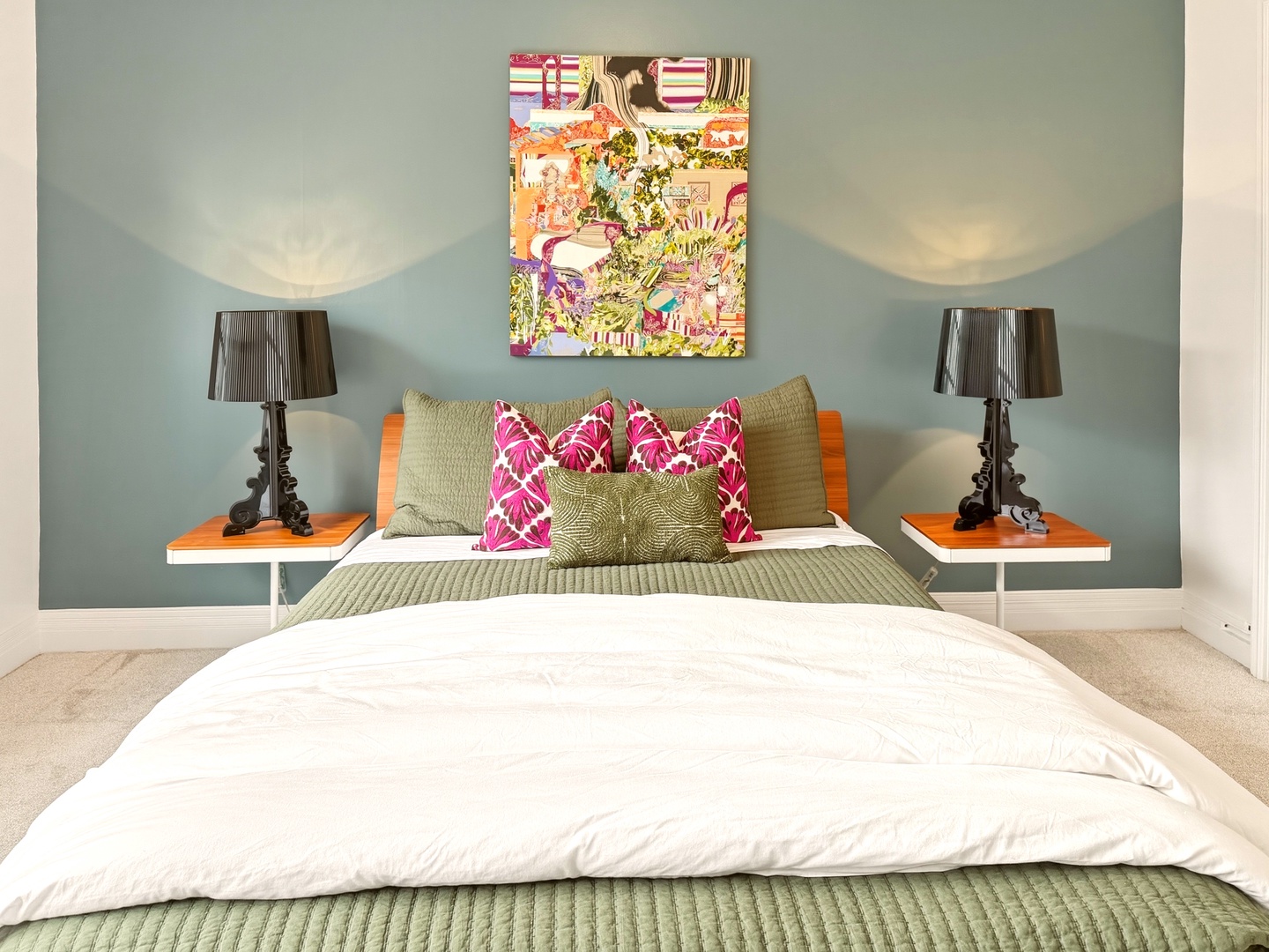Honolulu Vacation Rentals, Ho'okipa Villa - Slip into crisp white linens and sink into your colorful retreat, where vibrant art and cozy textures create the perfect restful escape.