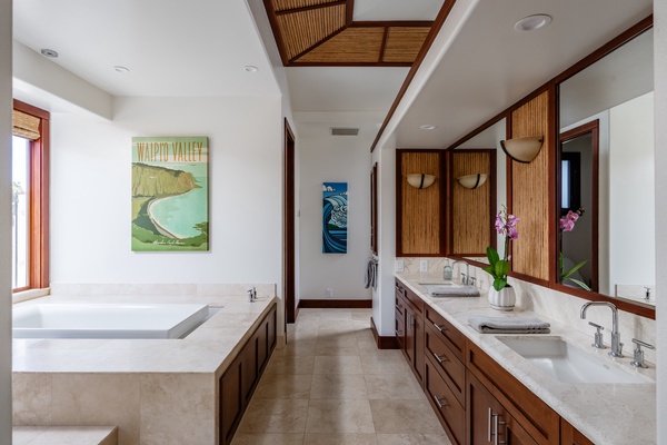 Kamuela Vacation Rentals, Canoe House & Beach Walker at Champion Ridge - Spacious bathroom featuring a soaking tub, dual sinks, and beautiful wooden accents, offering a luxurious and relaxing retreat.