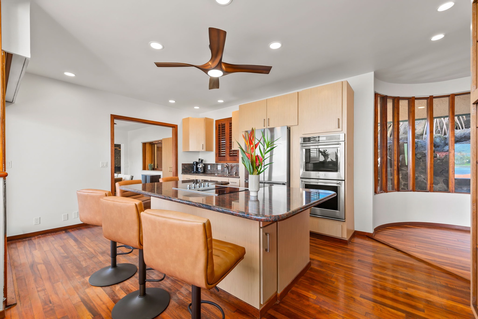 Honolulu Vacation Rentals, Black Point Ocean Villa - Your modern kitchen features sleek granite counters, stainless steel appliances, and a breakfast bar where you can enjoy morning coffee.